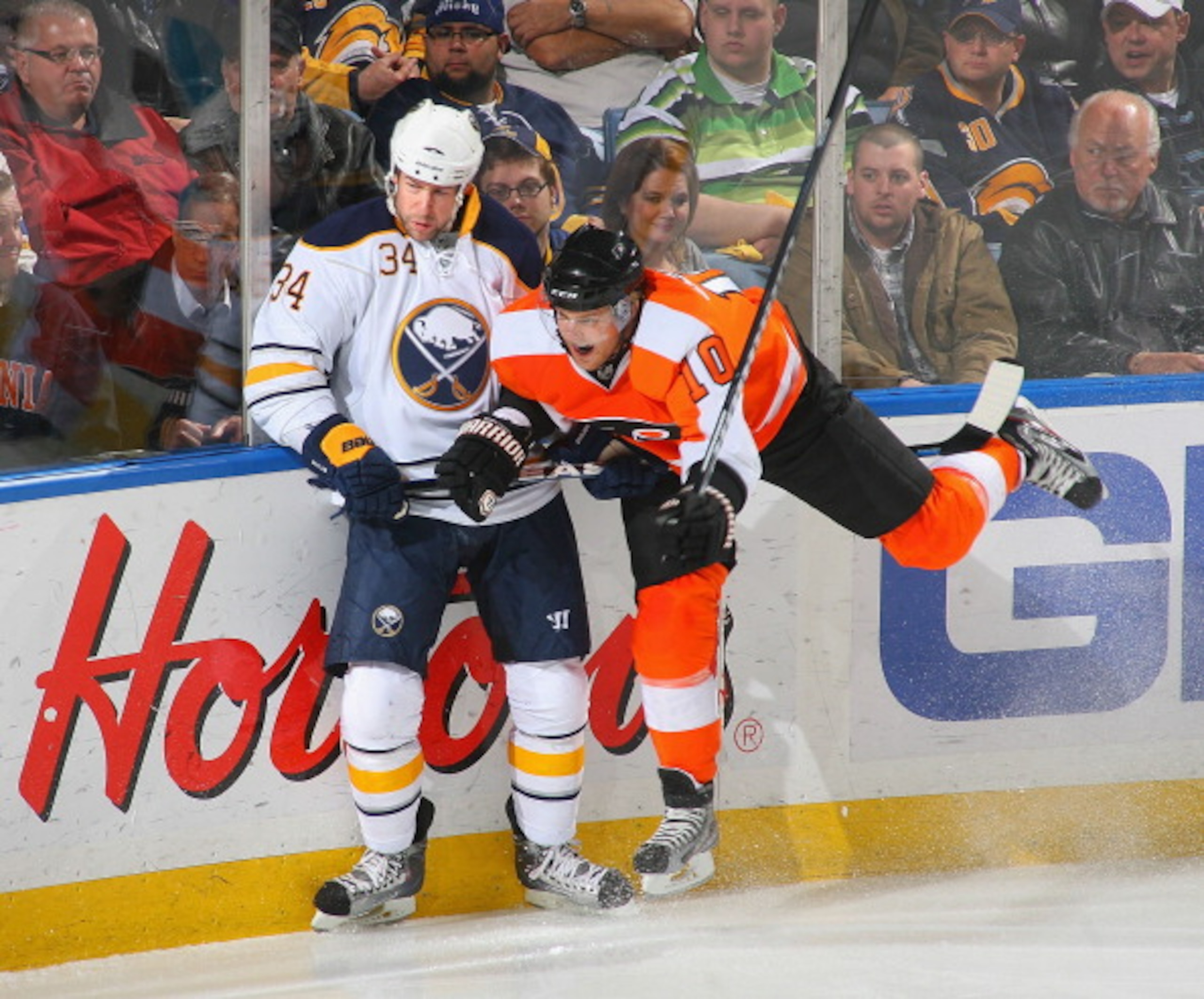 BUFFALO, NY - APRIL 08: Chris Butler #34 of the Buffalo Sabres collides with Kris Versteeg #10 of the Philadelphia Flyers at HSBC Arena on April 8, 2011 in Buffalo, New York. (Photo by Rick Stewart/Getty Images) BUFFALO, NY - APRIL 08: Chris Butler #34 of the Buffalo Sabres collides with Kris Versteeg #10 of the Philadelphia Flyers at HSBC Arena on April 8, 2011 in Buffalo, New York. (Photo by Rick Stewart/Getty Images)