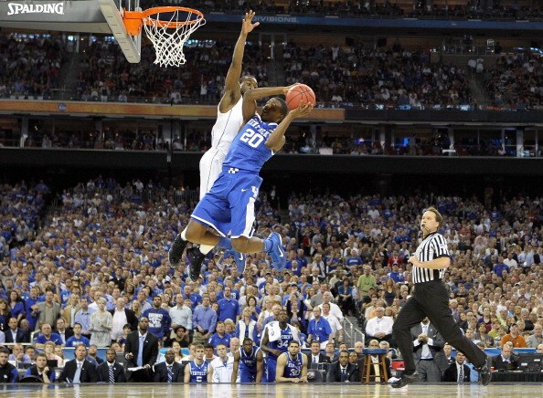 HOUSTON, TX - APRIL 02:  Doron Lamb #20 of the Kentucky Wildcats goes to the hoop against Kemba Walker #15 of the Connecticut Huskies during the National Semifinal game of the 2011 NCAA Division I Men's Basketball Championship at Reliant Stadium on April