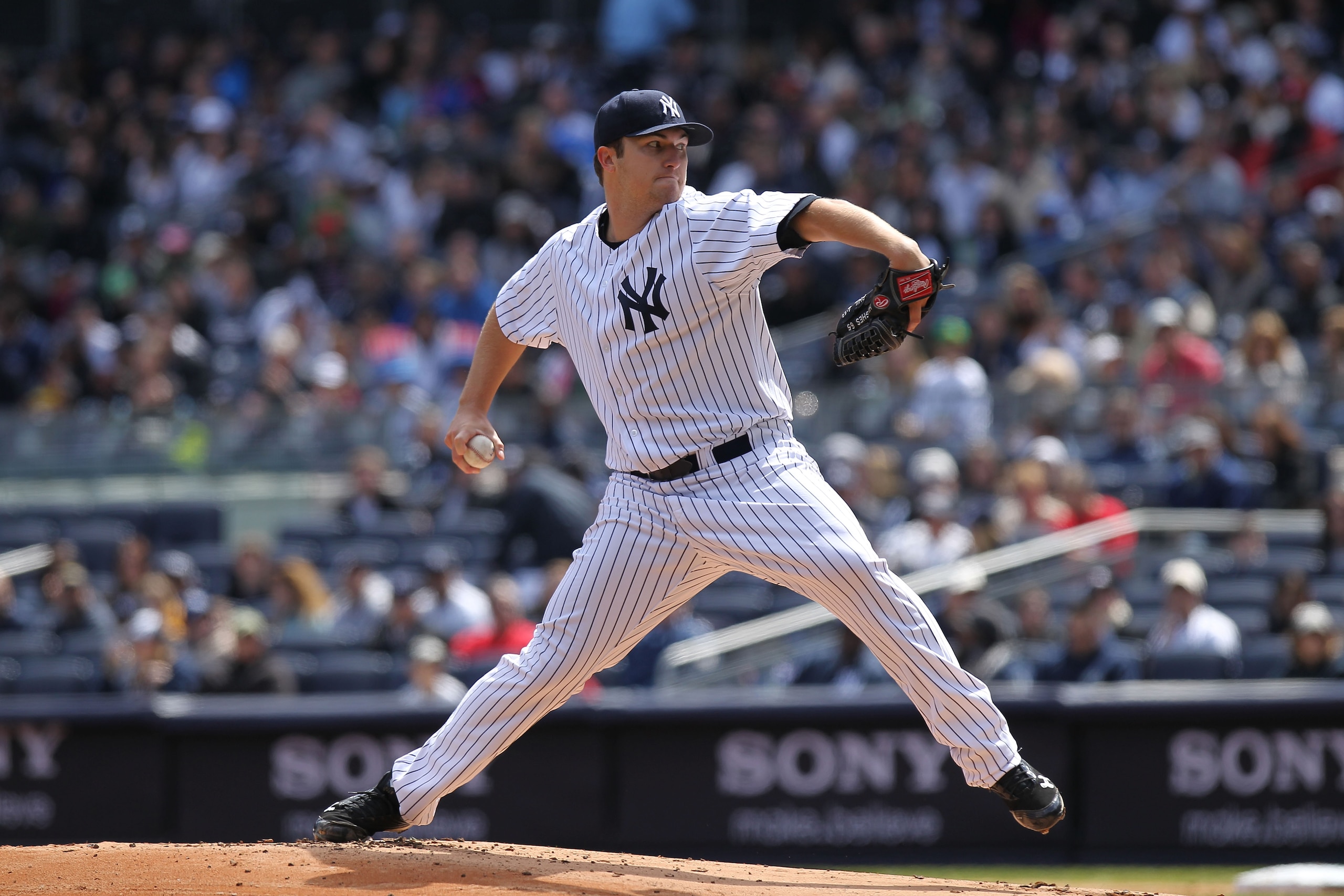 NEW YORK, NY - APRIL 03: Phil Hughes #65 of the New York Yankees pitches against the Detroit Tigers at Yankee Stadium on April 3, 2011 in the Bronx borough of New York City. (Photo by Nick Laham/Getty Images) NEW YORK, NY - APRIL 03: Phil Hughes #65 of the New York Yankees pitches against the Detroit Tigers at Yankee Stadium on April 3, 2011 in the Bronx borough of New York City. (Photo by Nick Laham/Getty Images)