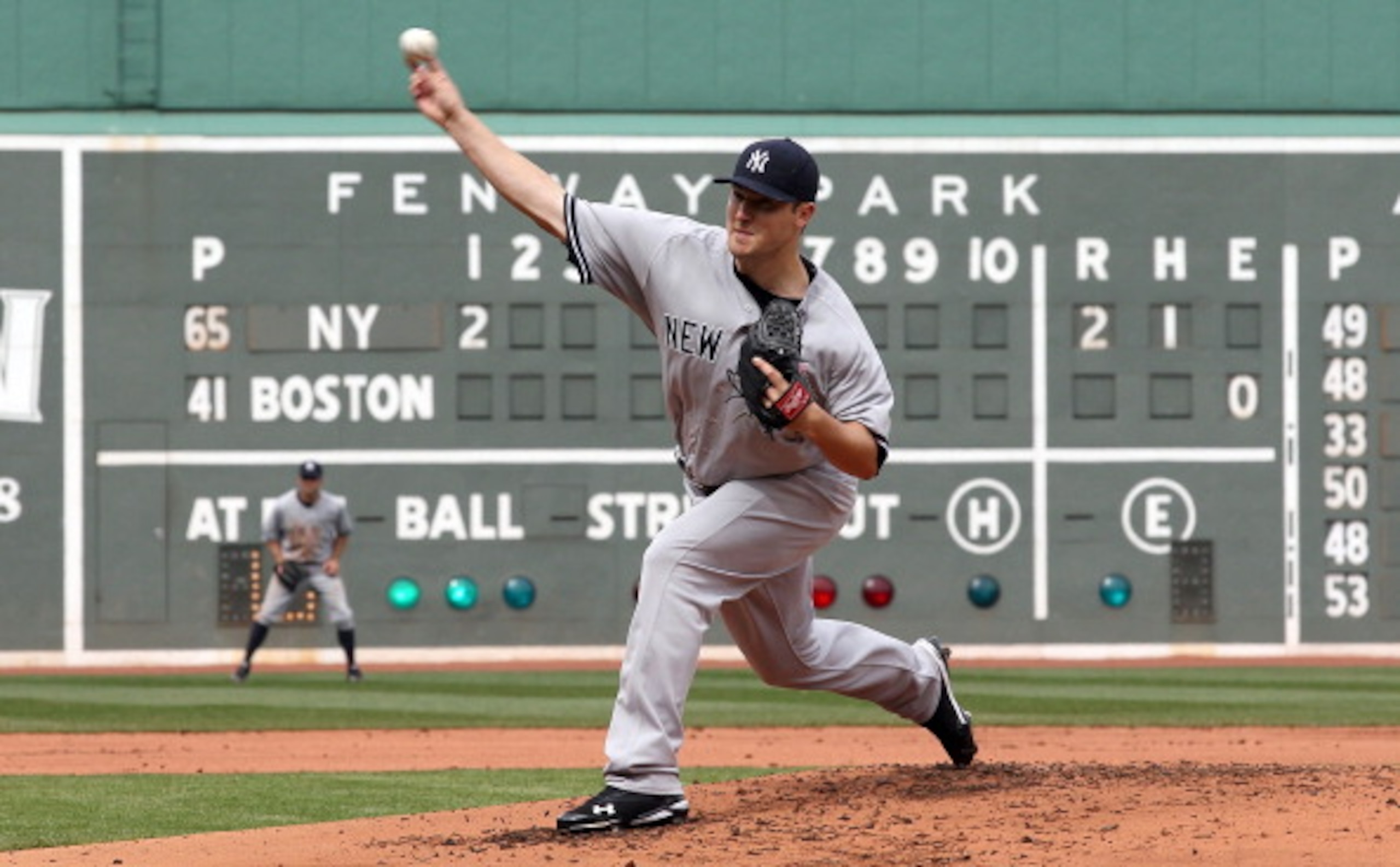 BOSTON, MA - APRIL 8: Phil Hughes #65 of New York Yankees throws against the Boston Red Sox in the first inning on Opening Day at Fenway Park on April 8, 2011 in Boston, Massachusetts. (Photo by Jim Rogash/Getty Images) BOSTON, MA - APRIL 8: Phil Hughes #65 of New York Yankees throws against the Boston Red Sox in the first inning on Opening Day at Fenway Park on April 8, 2011 in Boston, Massachusetts. (Photo by Jim Rogash/Getty Images)
