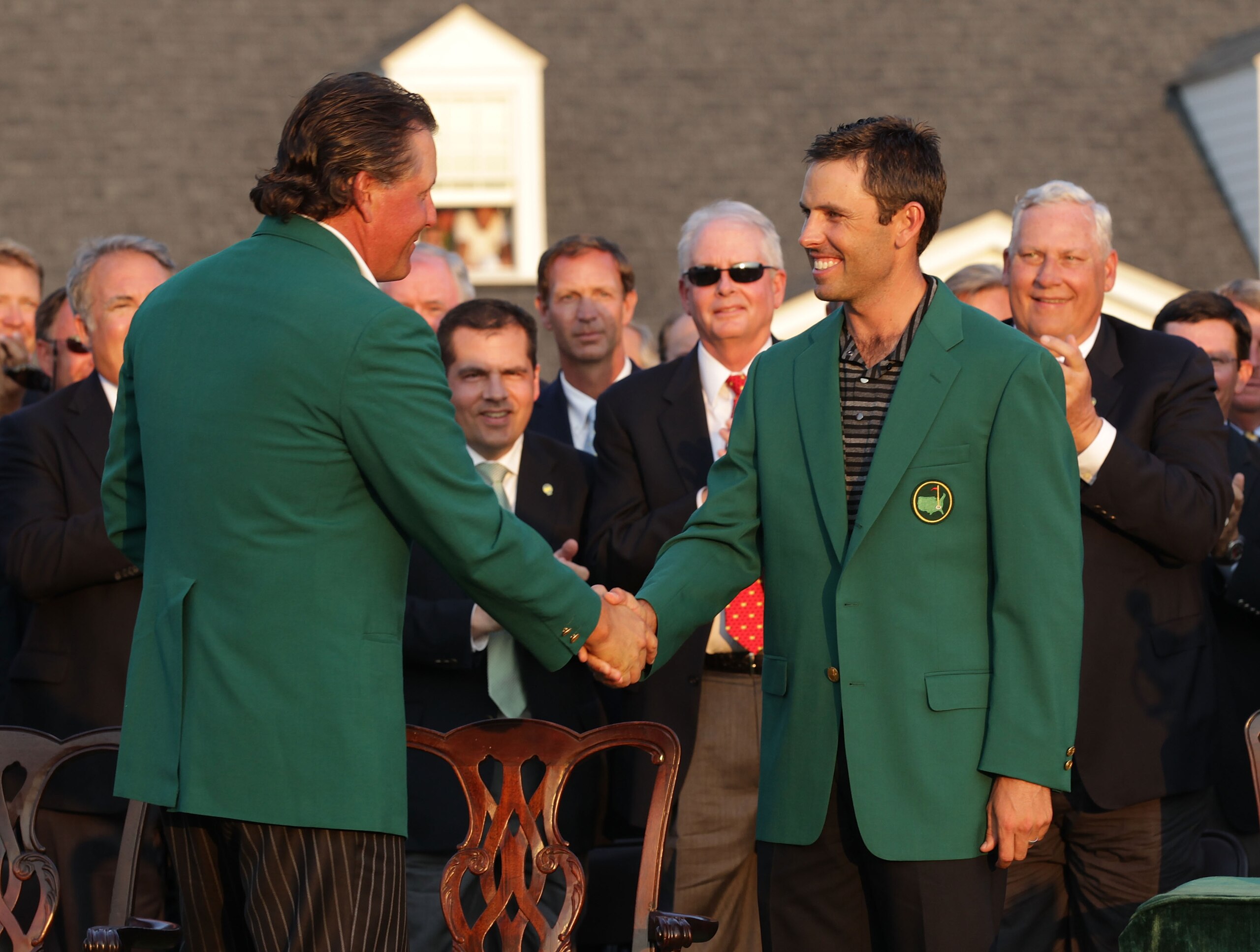 AUGUSTA, GA - APRIL 10:  Phil Mickelson (L) shakes hands with Charl Schwartzel of South Africa at the green jacket presentation after Schwartzel's two-stroke victory at the 2011 Masters Tournament at Augusta National Golf Club on April 10, 2011 in Augusta