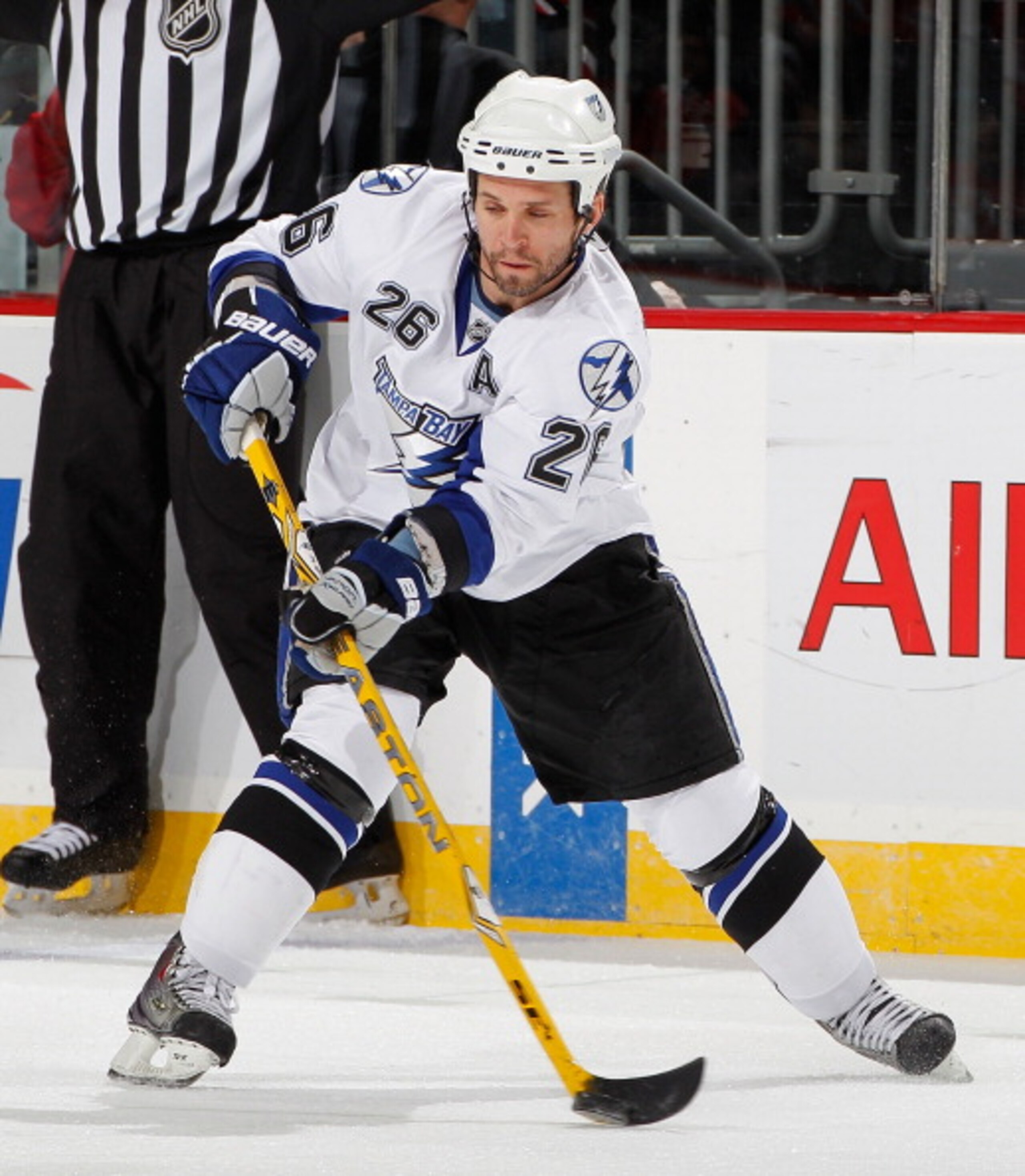 NEWARK, NJ - MARCH 02: Martin St. Louis #26 of the Tampa Bay Lightning passes during an NHL hockey game against the New Jersey Devils at the Prudential Center on March 2, 2011 in Newark, New Jersey. (Photo by Paul Bereswill/Getty Images) NEWARK, NJ - MARCH 02: Martin St. Louis #26 of the Tampa Bay Lightning passes during an NHL hockey game against the New Jersey Devils at the Prudential Center on March 2, 2011 in Newark, New Jersey. (Photo by Paul Bereswill/Getty Images)
