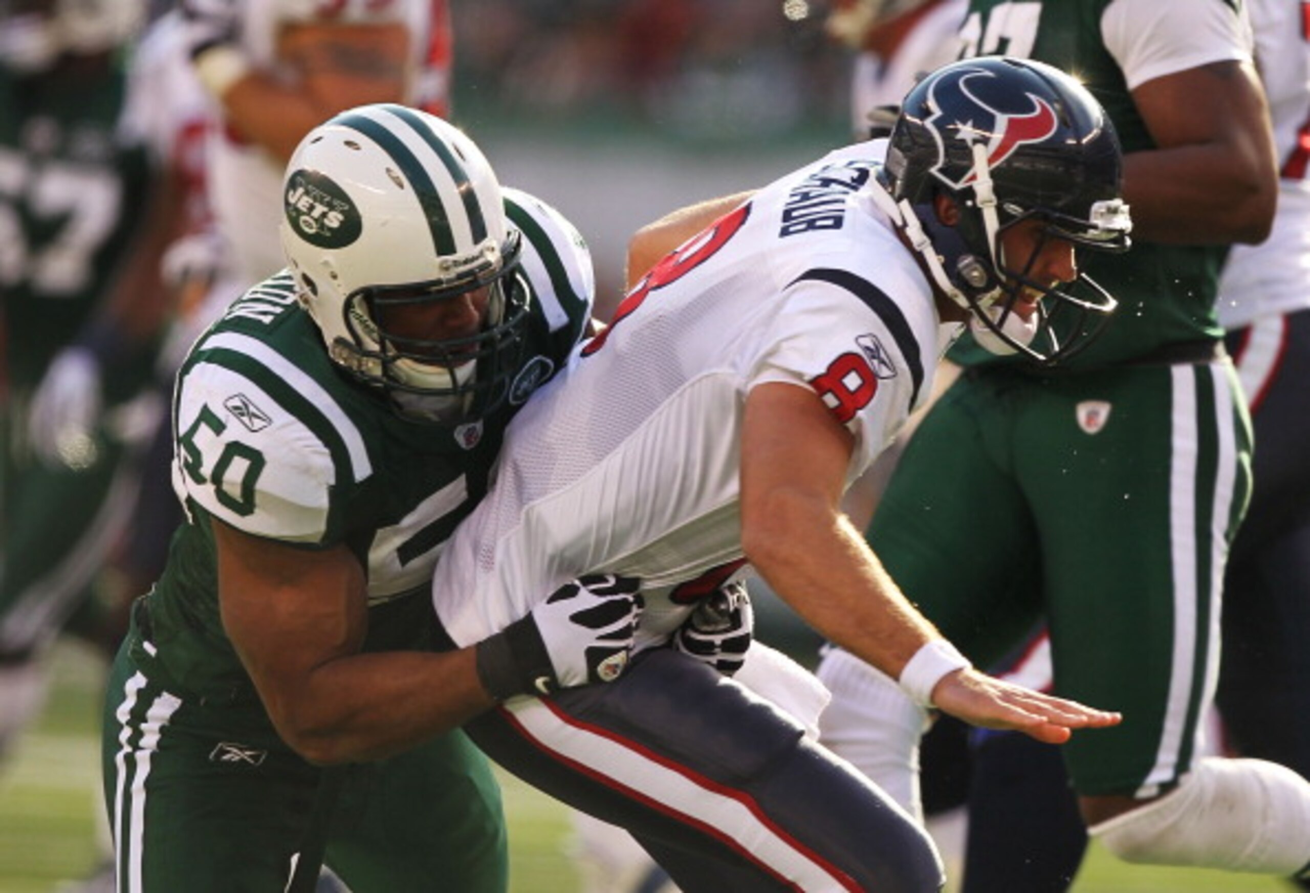 EAST RUTHERFORD, NJ - NOVEMBER 21: Vernon Gholston #50 of the New York Jets Tackles Matt Shaub #8 of the Houston Texans during their game on November21, 2010 at the New Meadowlands Stadium in East Rutherford, New Jersey. (Photo by Al Bello/Getty Image EAST RUTHERFORD, NJ - NOVEMBER 21: Vernon Gholston #50 of the New York Jets Tackles Matt Shaub #8 of the Houston Texans during their game on November21, 2010 at the New Meadowlands Stadium in East Rutherford, New Jersey. (Photo by Al Bello/Getty Image