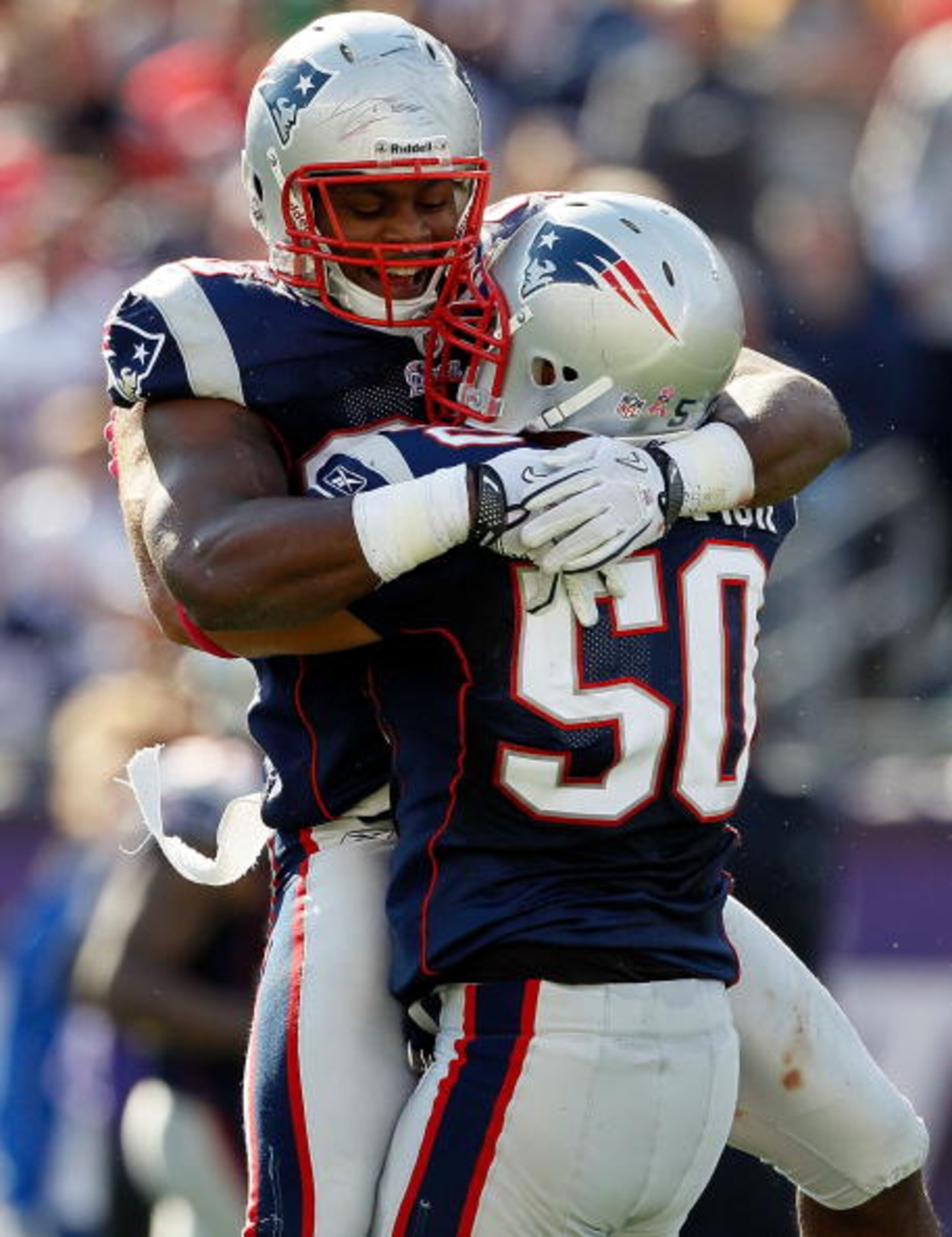 FOXBORO, MA - OCTOBER 17: Rob Ninkovich #50 of the New England Patriots celebrate with teammate Jermaine Cunningham #96 after Ninkovich sack Joe Flacco #5 of the Baltimore Ravens in the first half at Gillette Stadium on October 17, 2010 in Foxboro, Massa FOXBORO, MA - OCTOBER 17: Rob Ninkovich #50 of the New England Patriots celebrate with teammate Jermaine Cunningham #96 after Ninkovich sack Joe Flacco #5 of the Baltimore Ravens in the first half at Gillette Stadium on October 17, 2010 in Foxboro, Massa