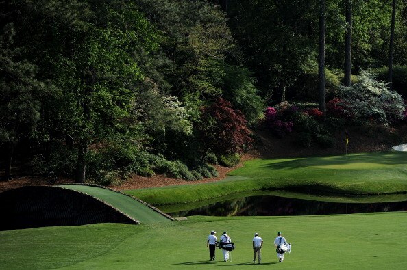 AUGUSTA, GA - APRIL 09:  (L-R) Rory McIlroy of Northern Ireland, caddie J.P. Fitzgerald, Jason Day of Australia and caddie Colin Swatton walks to the 12th green during the third round of the 2011 Masters Tournament at Augusta National Golf Club on April 9