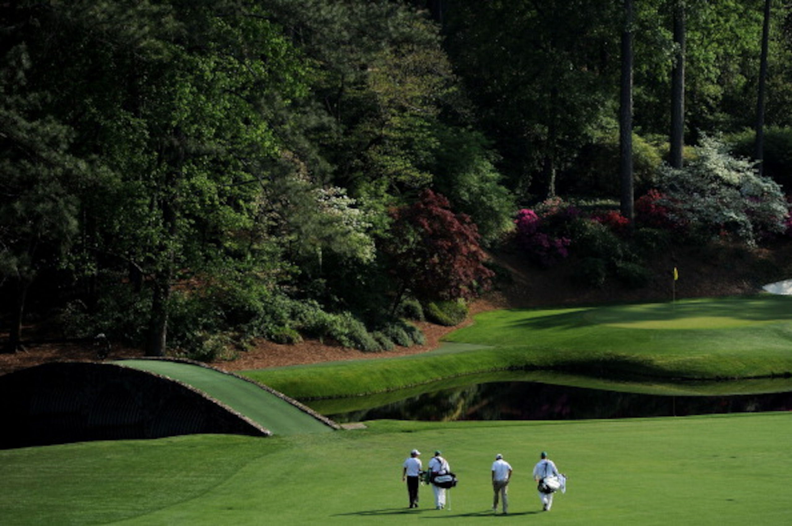 AUGUSTA, GA - APRIL 09: (L-R) Rory McIlroy of Northern Ireland, caddie J.P. Fitzgerald, Jason Day of Australia and caddie Colin Swatton walks to the 12th green during the third round of the 2011 Masters Tournament at Augusta National Golf Club on April 9 AUGUSTA, GA - APRIL 09: (L-R) Rory McIlroy of Northern Ireland, caddie J.P. Fitzgerald, Jason Day of Australia and caddie Colin Swatton walks to the 12th green during the third round of the 2011 Masters Tournament at Augusta National Golf Club on April 9