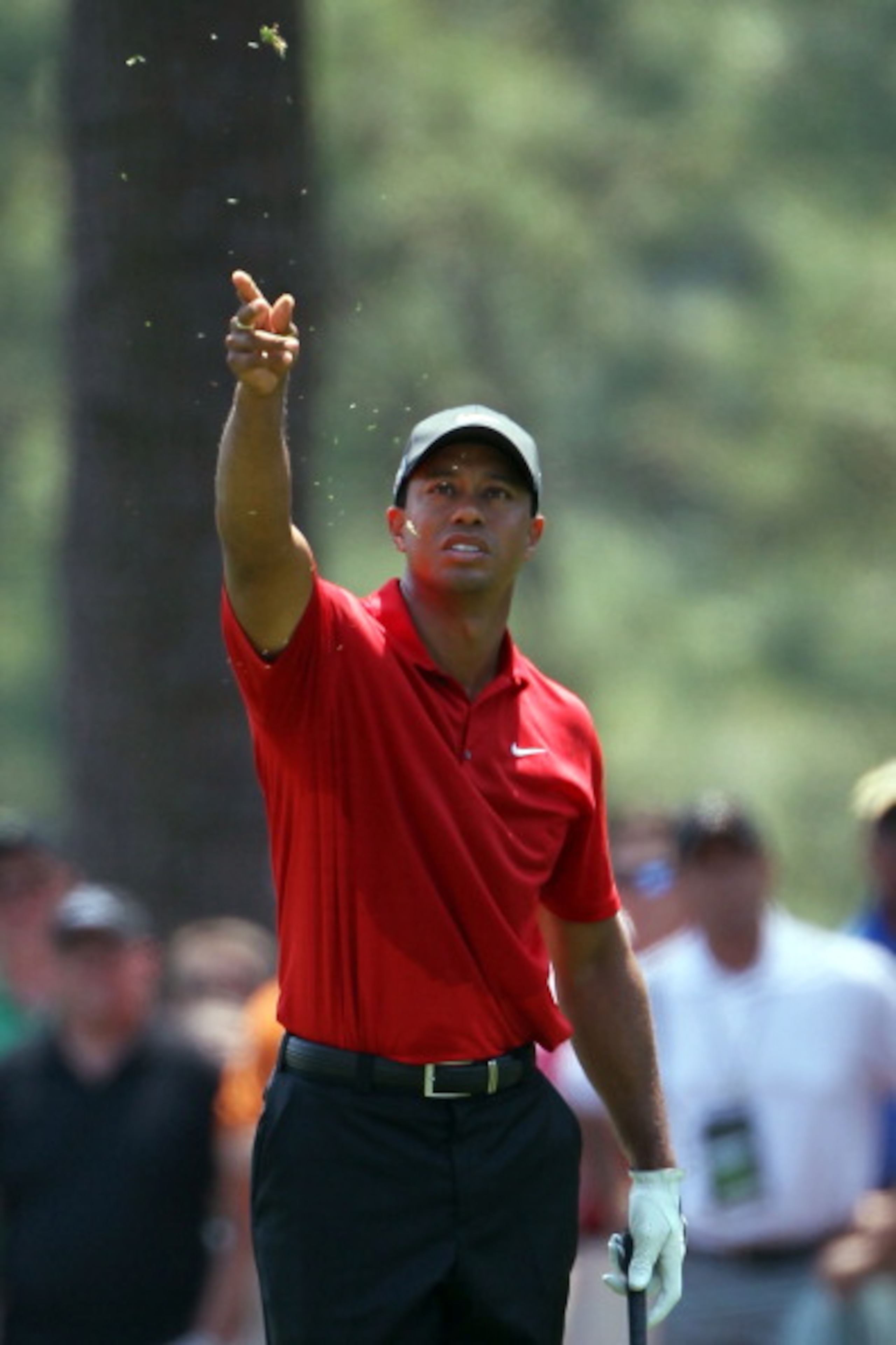 AUGUSTA, GA - APRIL 10: Tiger Woods checks the wind in the first fairway during the final round of the 2011 Masters Tournament at Augusta National Golf Club on April 10, 2011 in Augusta, Georgia. (Photo by Jamie Squire/Getty Images) AUGUSTA, GA - APRIL 10: Tiger Woods checks the wind in the first fairway during the final round of the 2011 Masters Tournament at Augusta National Golf Club on April 10, 2011 in Augusta, Georgia. (Photo by Jamie Squire/Getty Images)