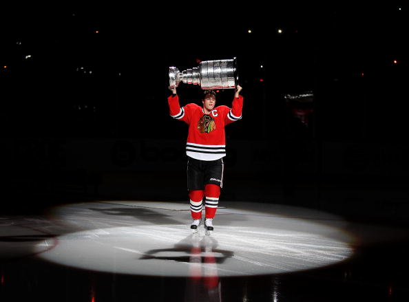 CHICAGO - OCTOBER 09: Jonathan Toews #19 of the Chicago Blackhawks carries the Stanley Cup across the ice in a ceremony before the Blackhawks season home opening game against the Detroit Red Wings at the United Center on October 9, 2010 in Chicago, Illino