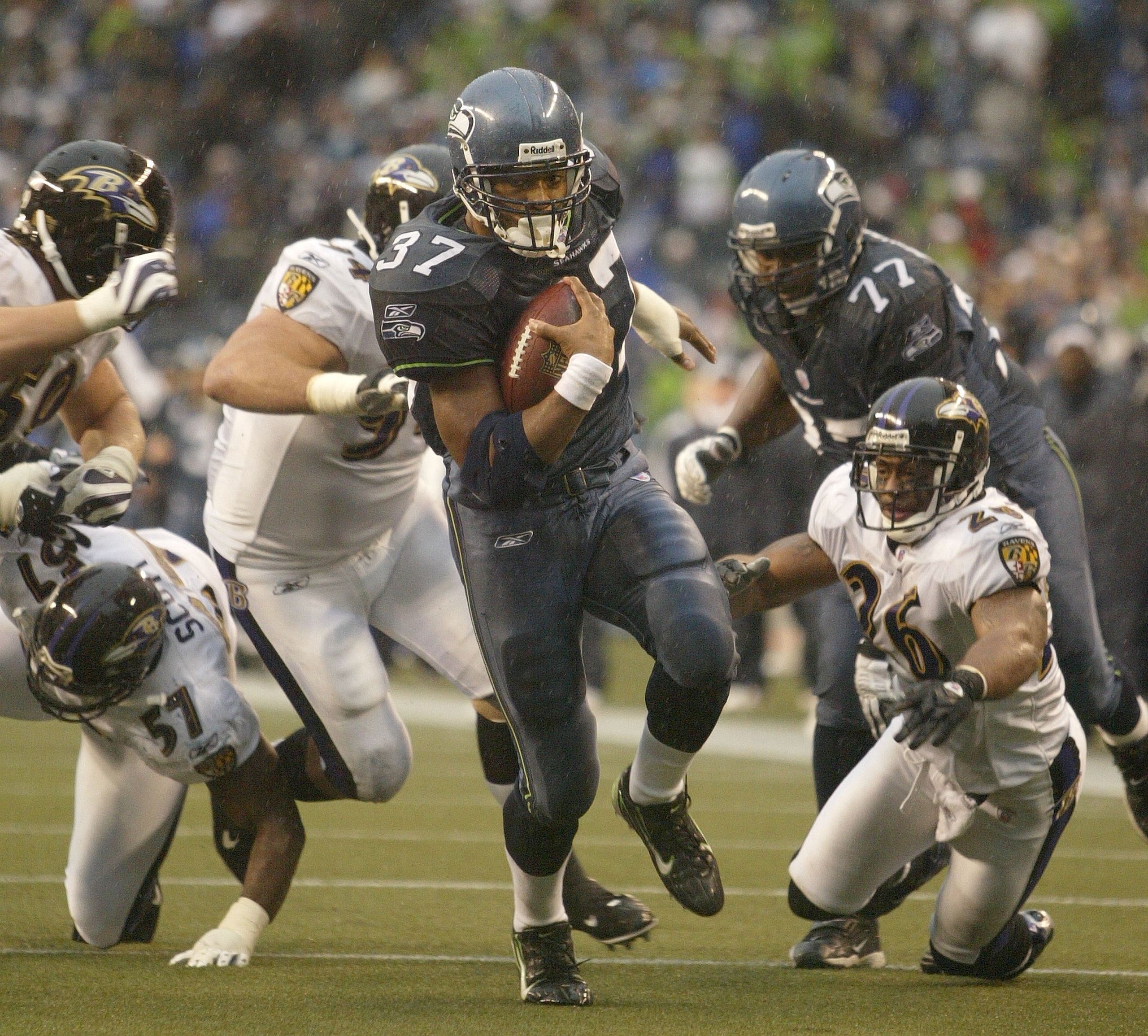 SEATTLE - DECEMBER 23:  Running back Shaun Alexander #37 of the Seattle Seahawks rushes for a touchdown in the second quarter against the Baltimore Ravens at Qwest Field on December 23, 2007 in Seattle, Washington. (Photo by Otto Greule Jr/Getty Images)