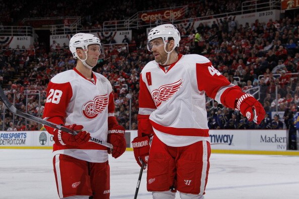 DETROIT, MI - MARCH 30: Brian Rafalski #28 and Henrik Zetterberg #40 of the Detroit Red Wings talk while playing aginst the St. Louis Blues at Joe Louis Arena on March 30, 2011 in Detroit, Michigan.  (Photo by Gregory Shamus/Getty Images)