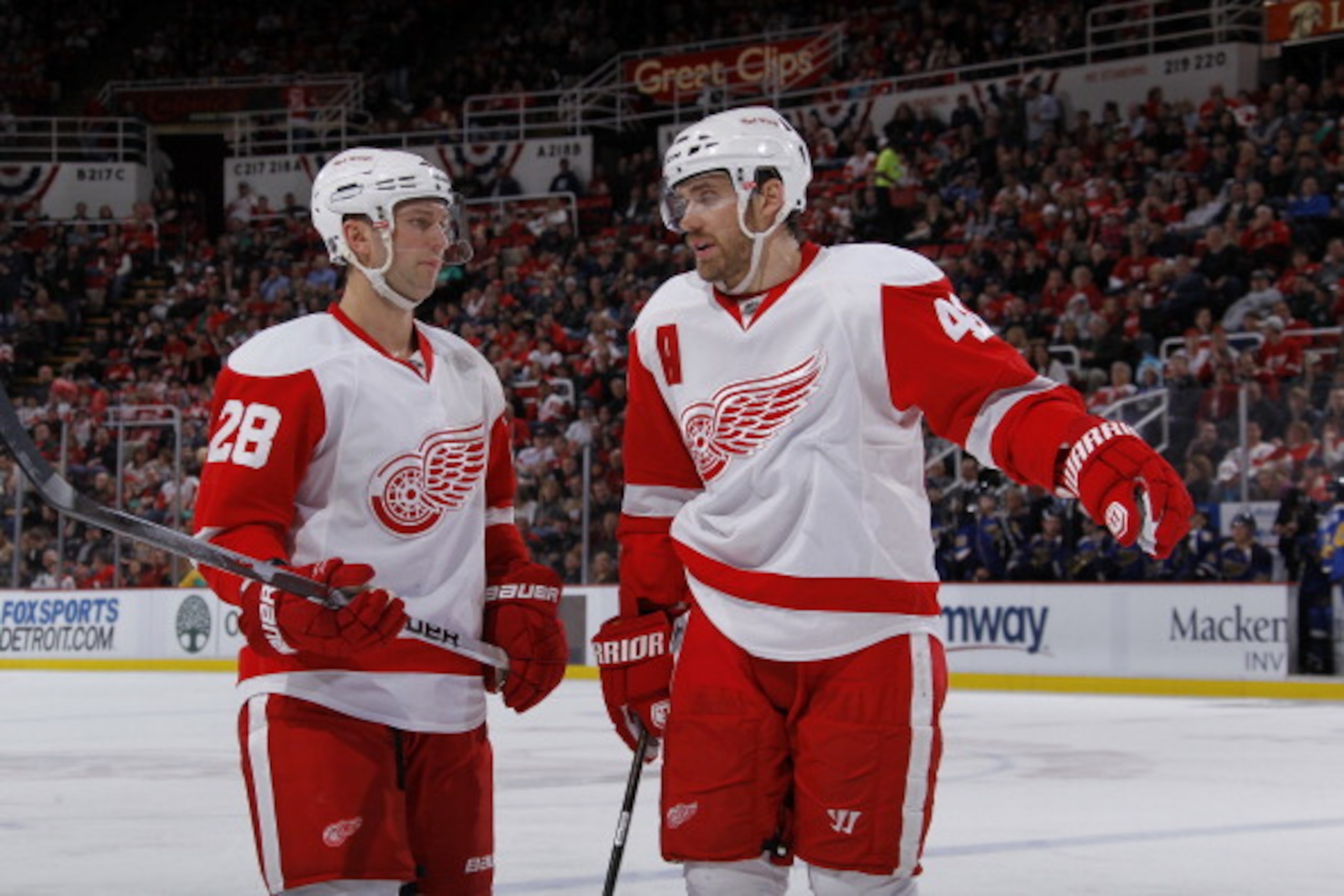 DETROIT, MI - MARCH 30: Brian Rafalski #28 and Henrik Zetterberg #40 of the Detroit Red Wings talk while playing aginst the St. Louis Blues at Joe Louis Arena on March 30, 2011 in Detroit, Michigan.  (Photo by Gregory Shamus/Getty Images)