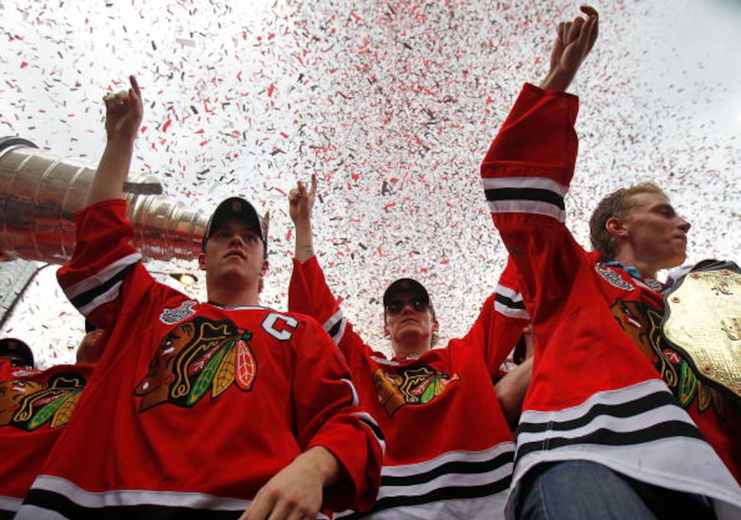 CHICAGO - JUNE 11: (L-R) Jonathan Toews #19, Tomas Kopecky #82 and Patrick Kane #88 celebrate with the crowd during the Chicago Blackhawks Stanley Cup victory parade and rally on June 11, 2010 in Chicago, Illinois. (Photo by Jonathan Daniel/Getty Images)