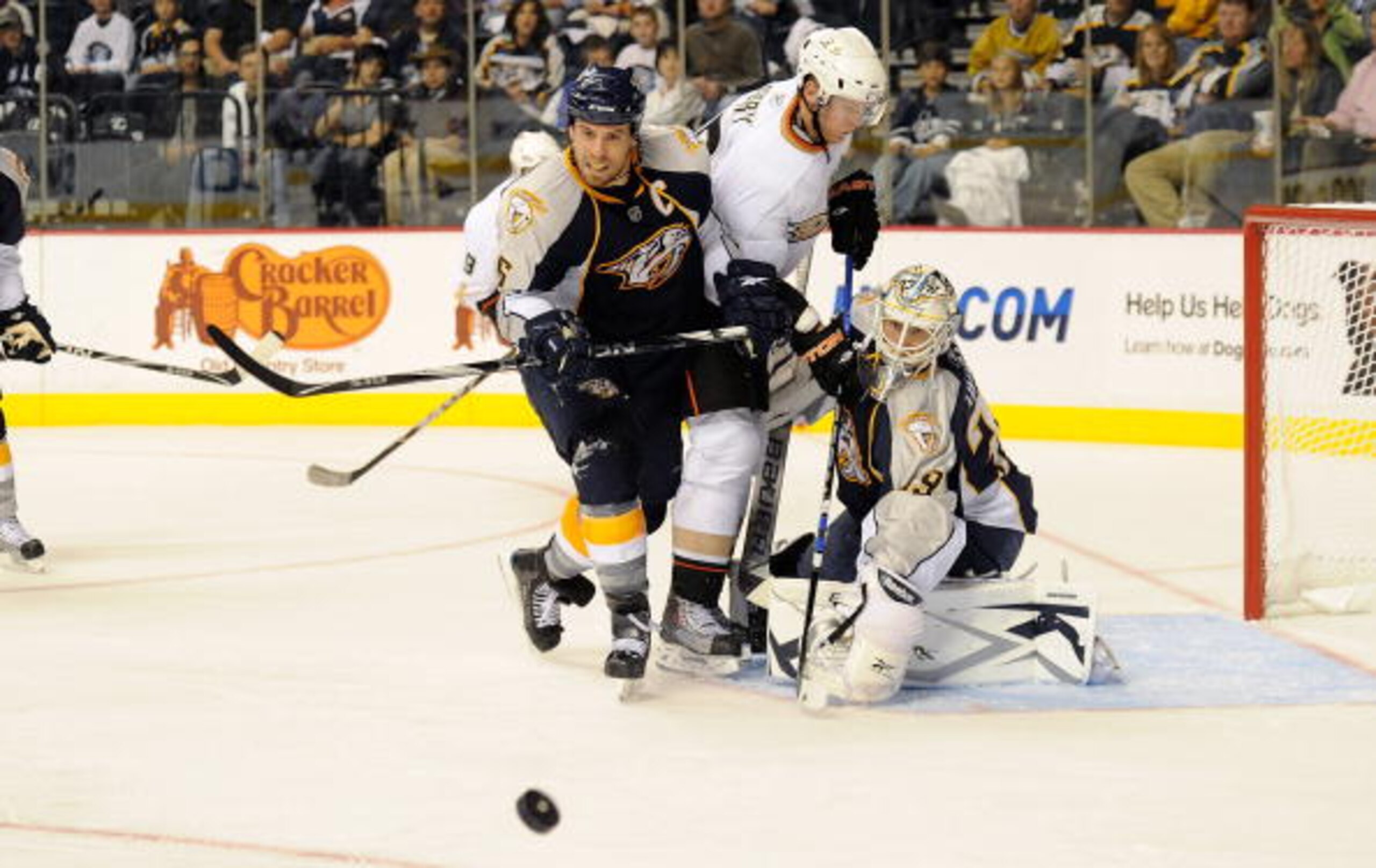 NASHVILLE, TN - OCTOBER 09:  Defenseman Shea Weber #6 of the Nashville Predators fights right wing Corey Perry #10 of the Anaheim Ducks in front of Predators goalie Anders Lindback #39 on October 9, 2010 in Nashville, Tennessee.  (Photo by Frederick Breed