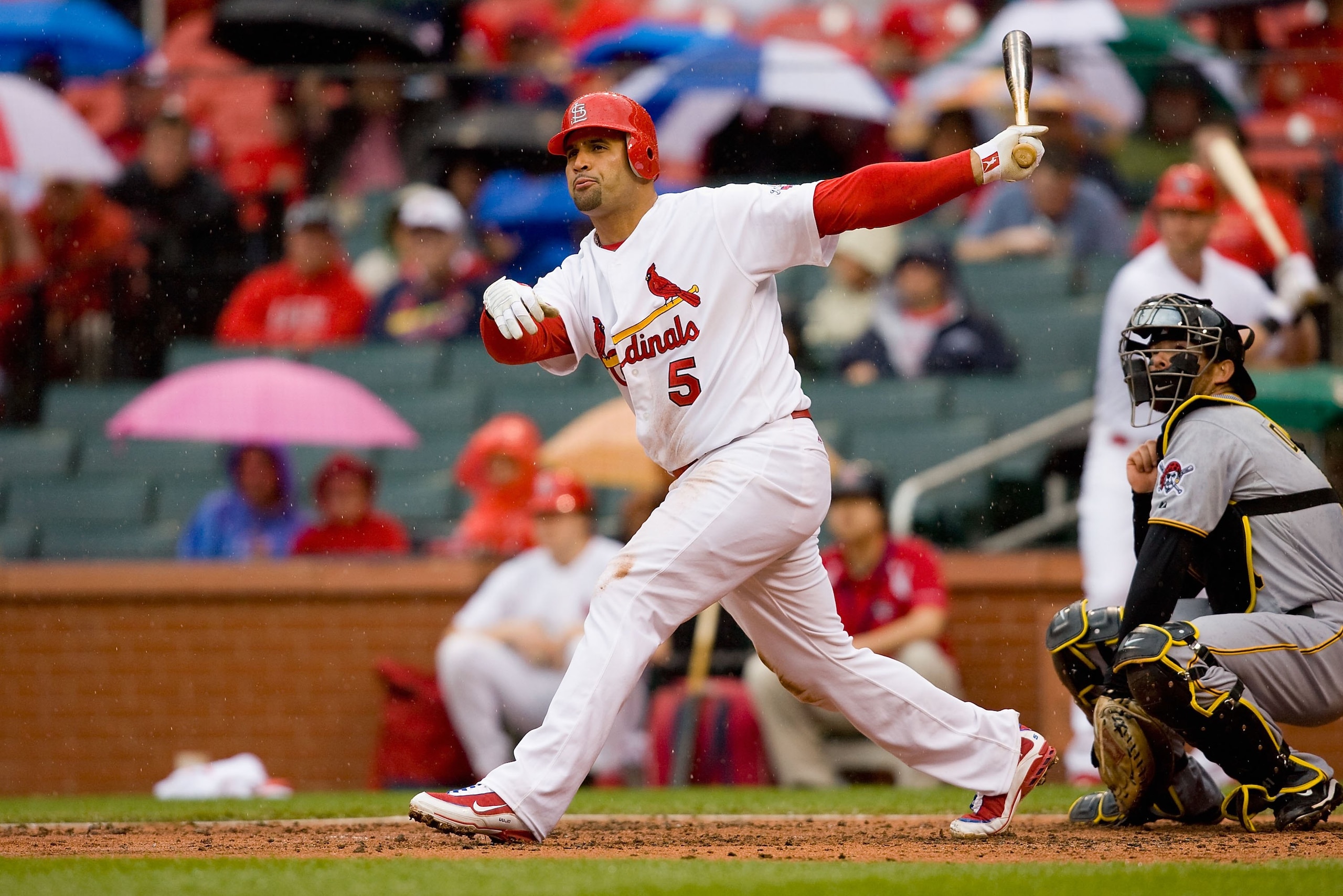 ST. LOUIS - APRIL 9:  Albert Pujols #5 of the St. Louis Cardinals follows through on his swing during the MLB game against the Pittsburgh Pirates on April 9, 2009 at Busch Stadium in St. Louis, Missouri.  The Cardinals defeated the Pirates 2-1.  (Photo by