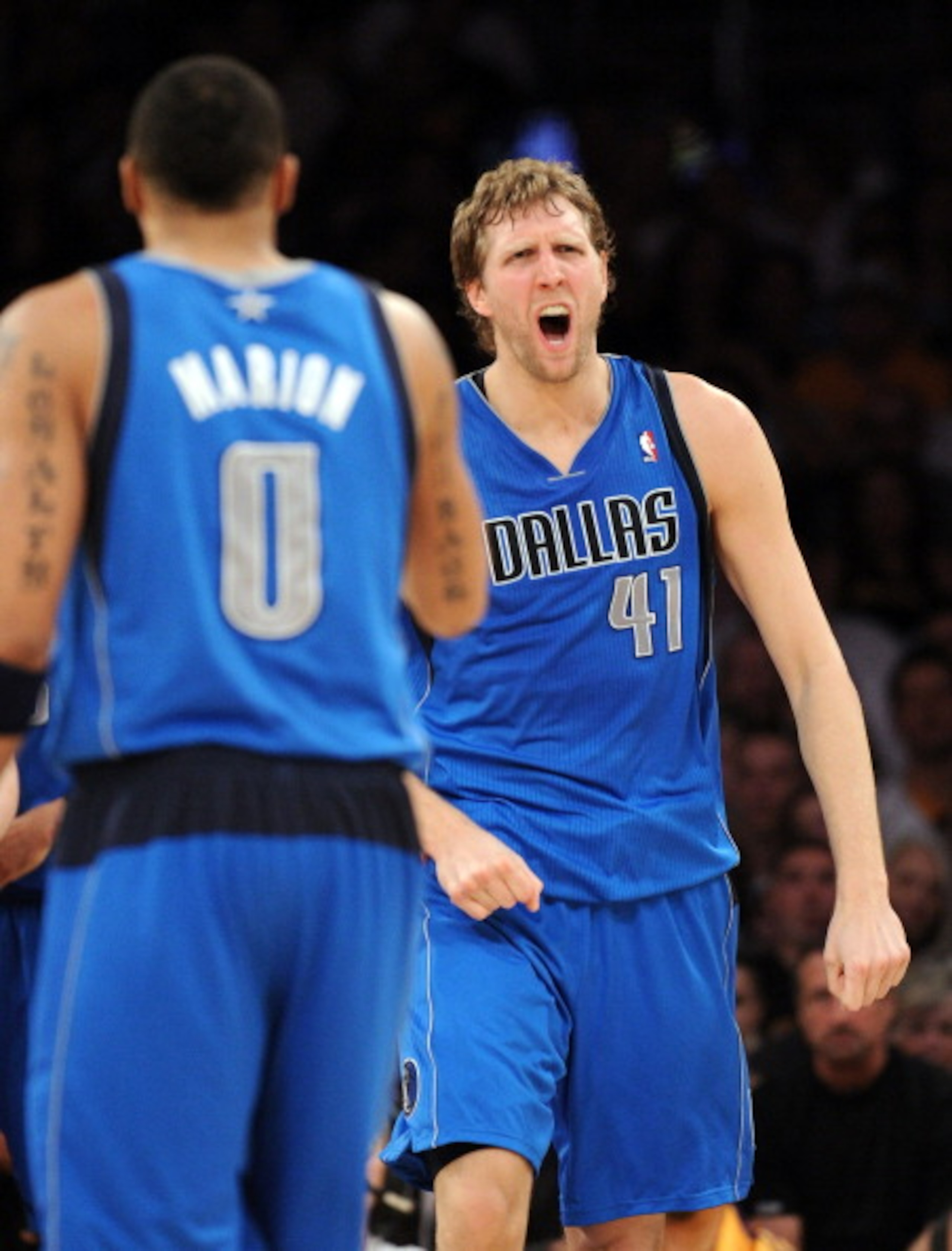 LOS ANGELES, CA - MARCH 31: Dirk Nowitzki #41 of the Dallas Mavericks reacts to his basket in front of Shawn Marion #0 against the Los Angeles Lakers at Staples Center on March 31, 2011 in Los Angeles, California. NOTE TO USER: User expressly acknowledg LOS ANGELES, CA - MARCH 31: Dirk Nowitzki #41 of the Dallas Mavericks reacts to his basket in front of Shawn Marion #0 against the Los Angeles Lakers at Staples Center on March 31, 2011 in Los Angeles, California. NOTE TO USER: User expressly acknowledg