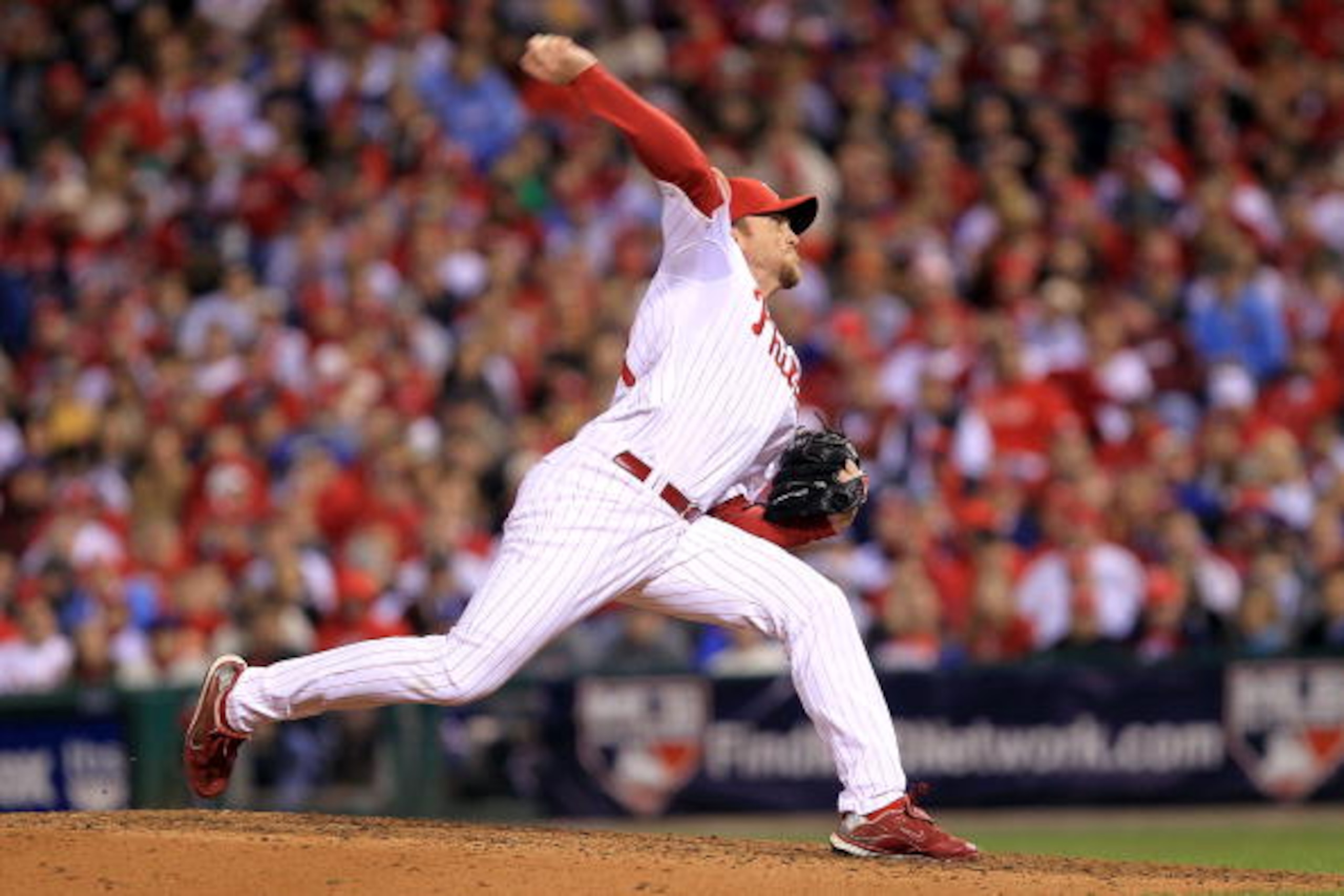PHILADELPHIA - OCTOBER 16:  Brad Lidge #54 of the Philadelphia Phillies pitches in the ninth inning against the San Francisco Giants in Game One of the NLCS during the 2010 MLB Playoffs at Citizens Bank Park on October 16, 2010 in Philadelphia, Pennsylvan
