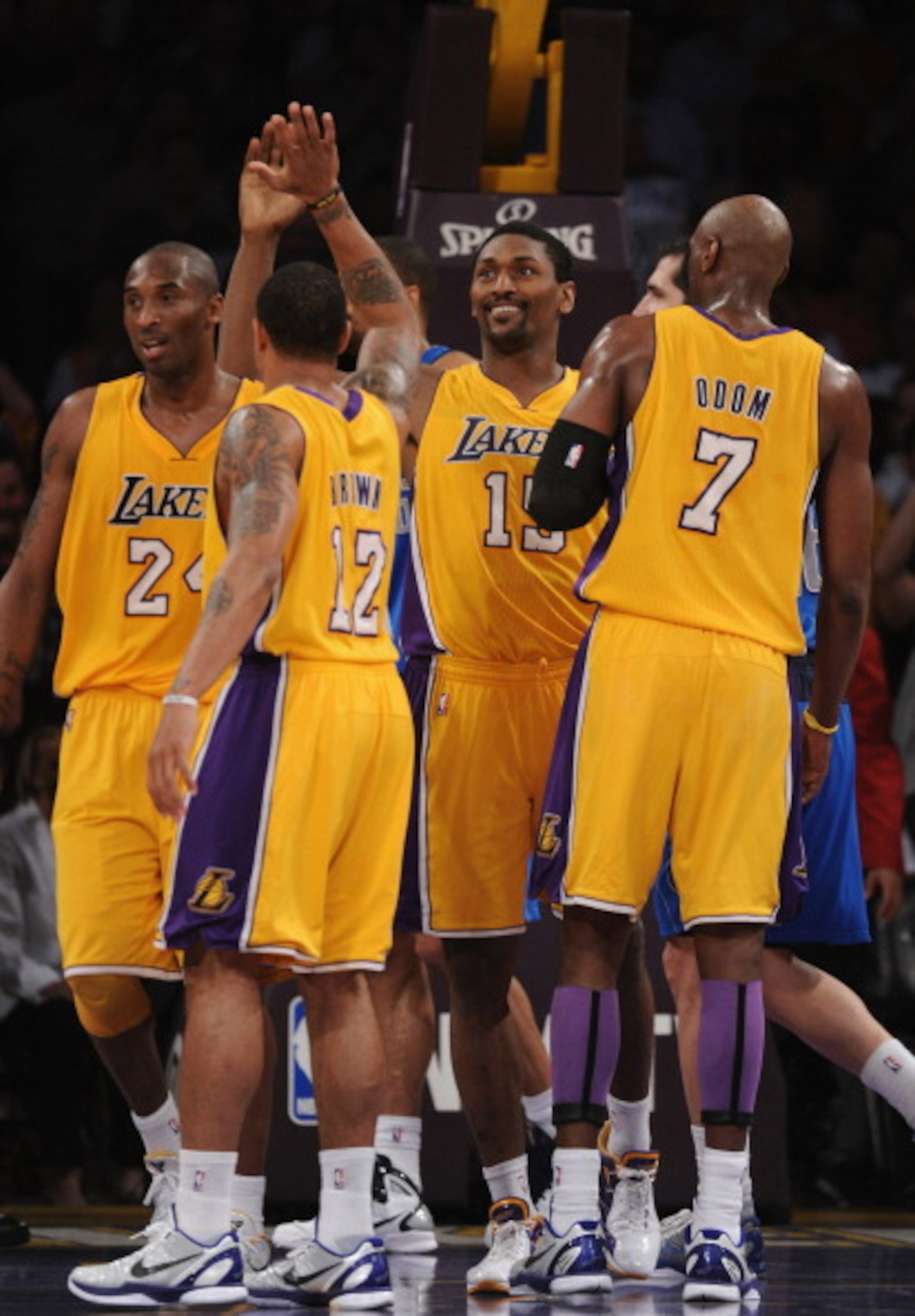 LOS ANGELES, CA - MARCH 31: Ron Artest #15 of the Los Angeles Lakers celebrates his basket and a foul with Shannon Brown #12, Kobe Bryant #24 and Lamar Odom #7 during a 110-82 win over the Dallas Mavericks at Staples Center on March 31, 2011 in Los Angel LOS ANGELES, CA - MARCH 31: Ron Artest #15 of the Los Angeles Lakers celebrates his basket and a foul with Shannon Brown #12, Kobe Bryant #24 and Lamar Odom #7 during a 110-82 win over the Dallas Mavericks at Staples Center on March 31, 2011 in Los Angel