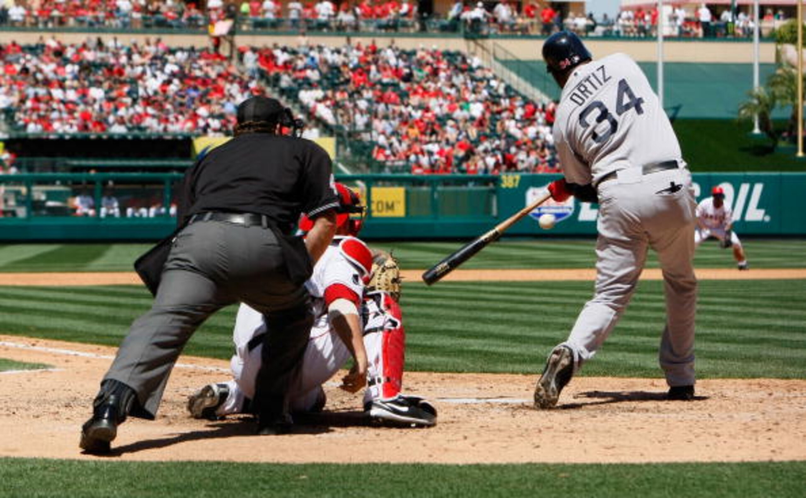 ANAHEIM, CA - APRIL 12:  David Ortiz #34 of the Boston Red Sox swings at a pitch against the Los Angeles Angels of Anaheim at Angel Stadium on April 12, 2009 in Anaheim, California. The Angels defeated the Red Sox 5-4.  (Photo by Jeff Gross/Getty Images)