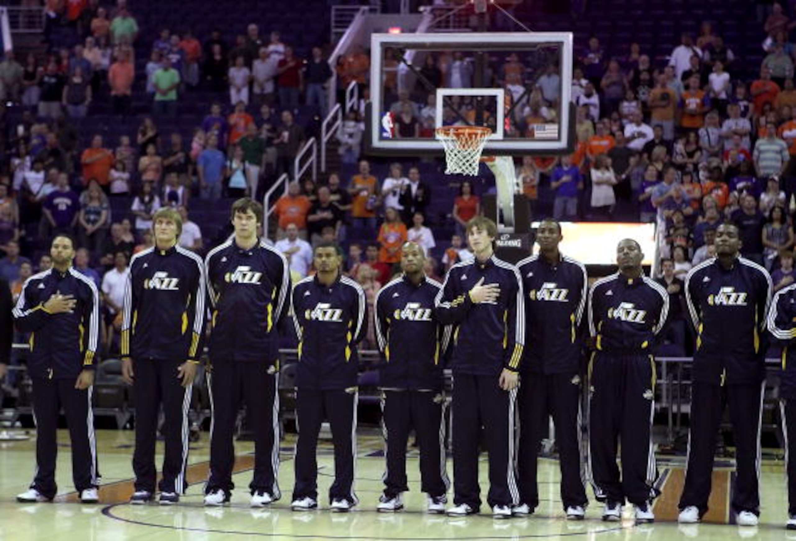 PHOENIX - OCTOBER 12:  The Utah Jazz stand attended for the National Anthem before the preseason NBA game against the Phoenix Suns at US Airways Center on October 12, 2010 in Phoenix, Arizona. NOTE TO USER: User expressly acknowledges and agrees that, by 