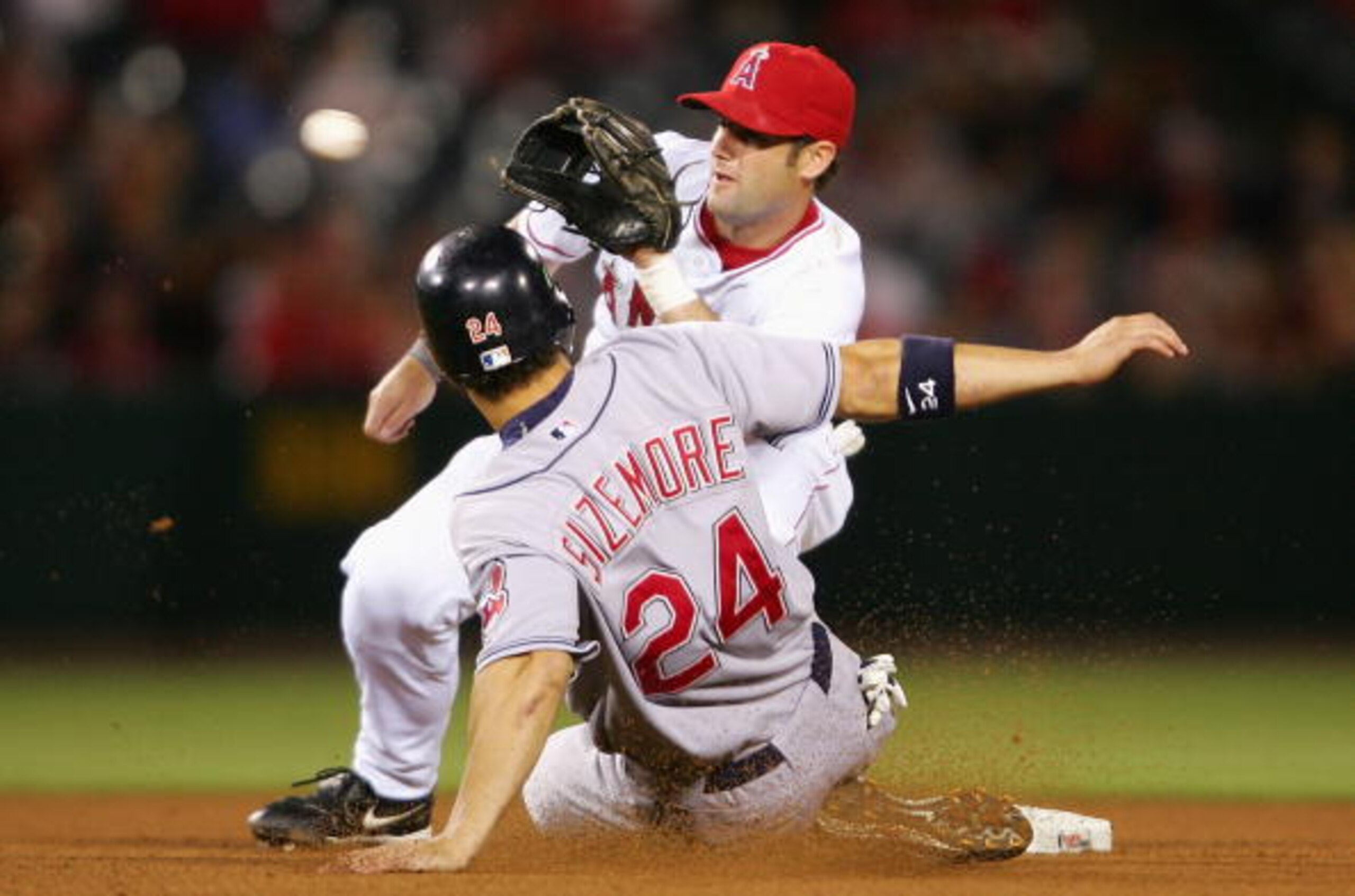 ANAHEIM, CA - MAY 9:  Grady Sizemore #24 of the Cleveland Indians is tagged out on a steal attempt in the sixth inning by Adam Kennedy #2 of the Los Angeles Angels of Anaheim at Angel Stadium May 9, 2005 in Anaheim, California.  (Photo by Nick Laham/Getty