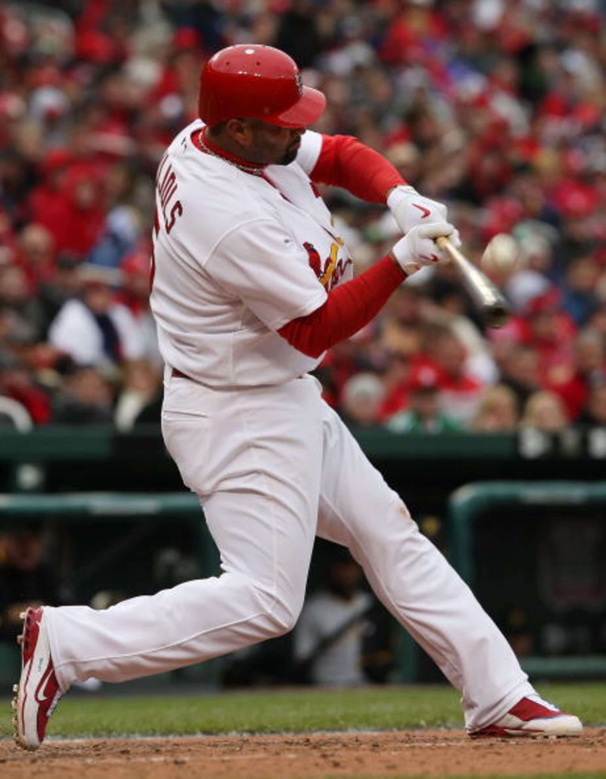 ST. LOUIS - APRIL 06:  :  Albert Pujols #5 of the St. Louis Cardinals takes a swing against the Pittsburgh Pirates during Opening Day on April 6, 2009  at Busch Stadium in St. Louis, Missouri. The Pittsburgh Pirates defeated the St. Louis Cardinals 6-4.