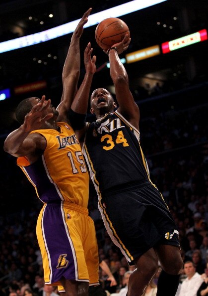 LOS ANGELES, CA - APRIL 05:  C.J. Miles #34 of the Utah Jazz goes up for a shot against Ron Artest #15 of the Los Angeles Lakers at Staples Center on April 5, 2011 in Los Angeles, California.  NOTE TO USER: User expressly acknowledges and agrees that, by 