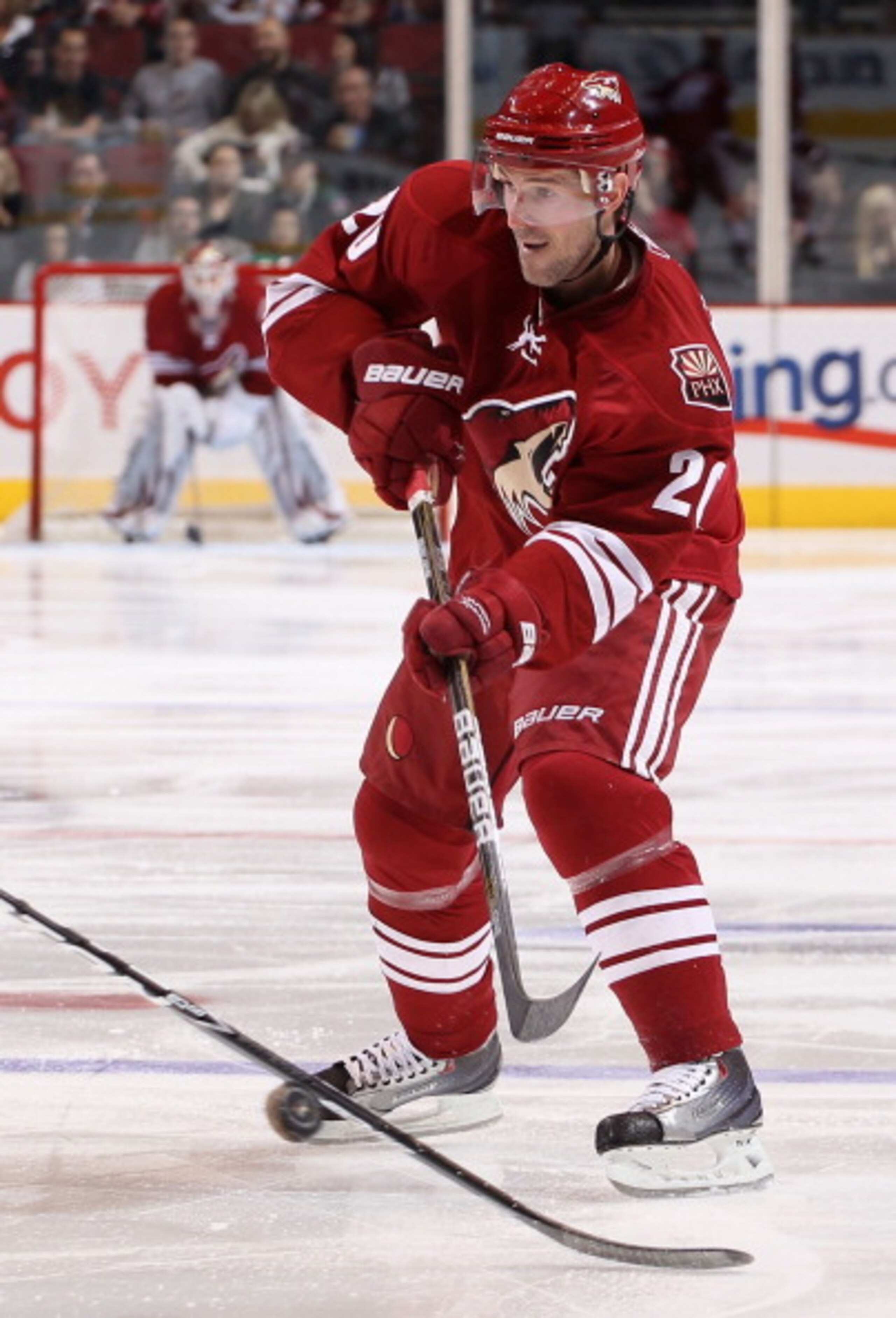 GLENDALE, AZ - APRIL 01:  Eric Belanger #20 of the Phoenix Coyotes skates with the puck during the NHL game against the Colorado Avalanche at Jobing.com Arena on April 1, 2011 in Glendale, Arizona.  The Avalanche defeated the Coyotes 4-3 in an overtime sh