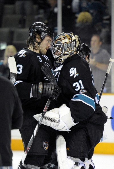 SAN JOSE, CA - MARCH 31: Antti Niemi #31 of  the San Jose Sharks celebrates with teammate Douglas Murray #3 after the Sharks defeated the Dallas Stars 6-0 in an NHL hockey game at the HP Pavilion on March 31, 2011 in San Jose, California. (Photo by Thearo