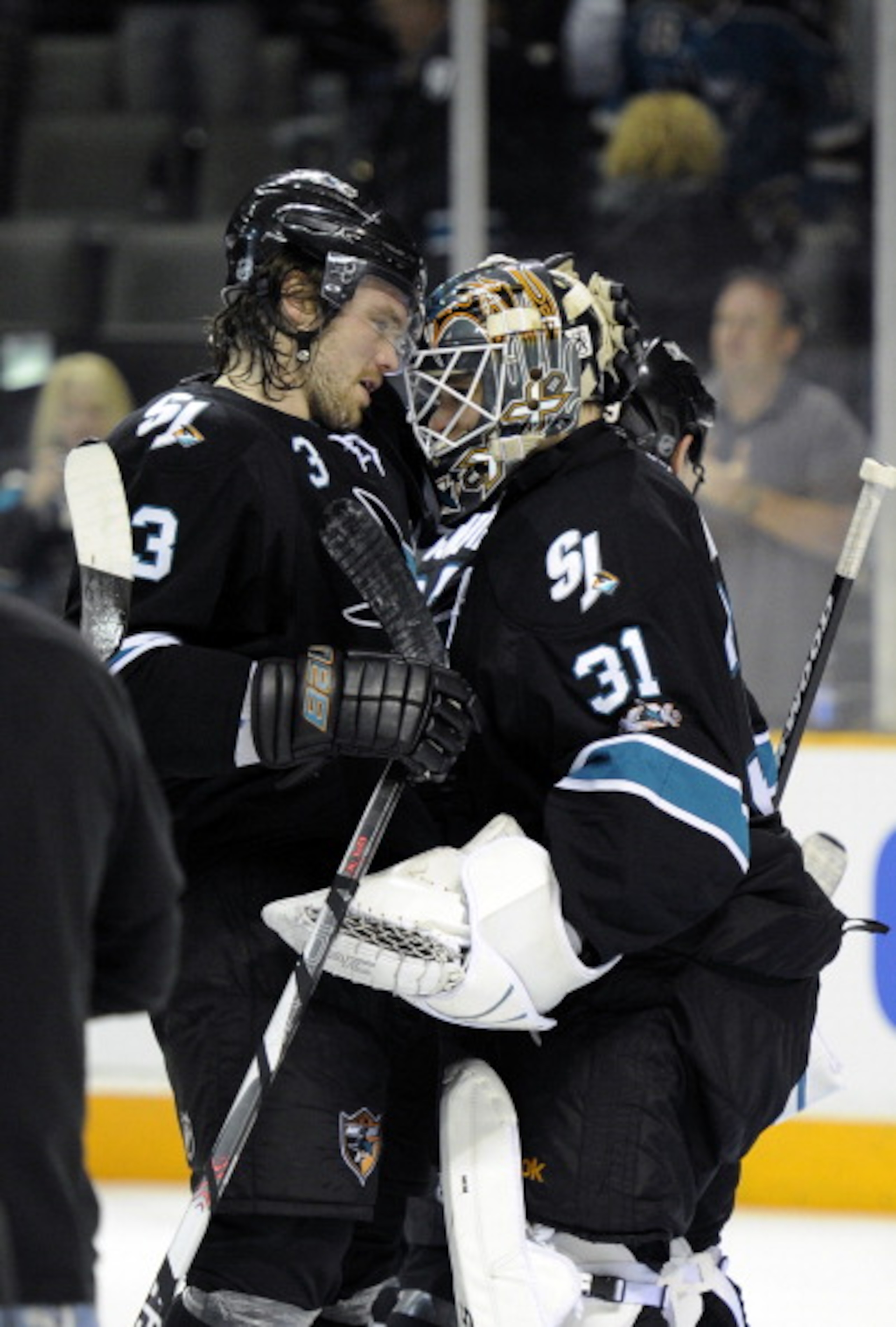 SAN JOSE, CA - MARCH 31: Antti Niemi #31 of  the San Jose Sharks celebrates with teammate Douglas Murray #3 after the Sharks defeated the Dallas Stars 6-0 in an NHL hockey game at the HP Pavilion on March 31, 2011 in San Jose, California. (Photo by Thearo