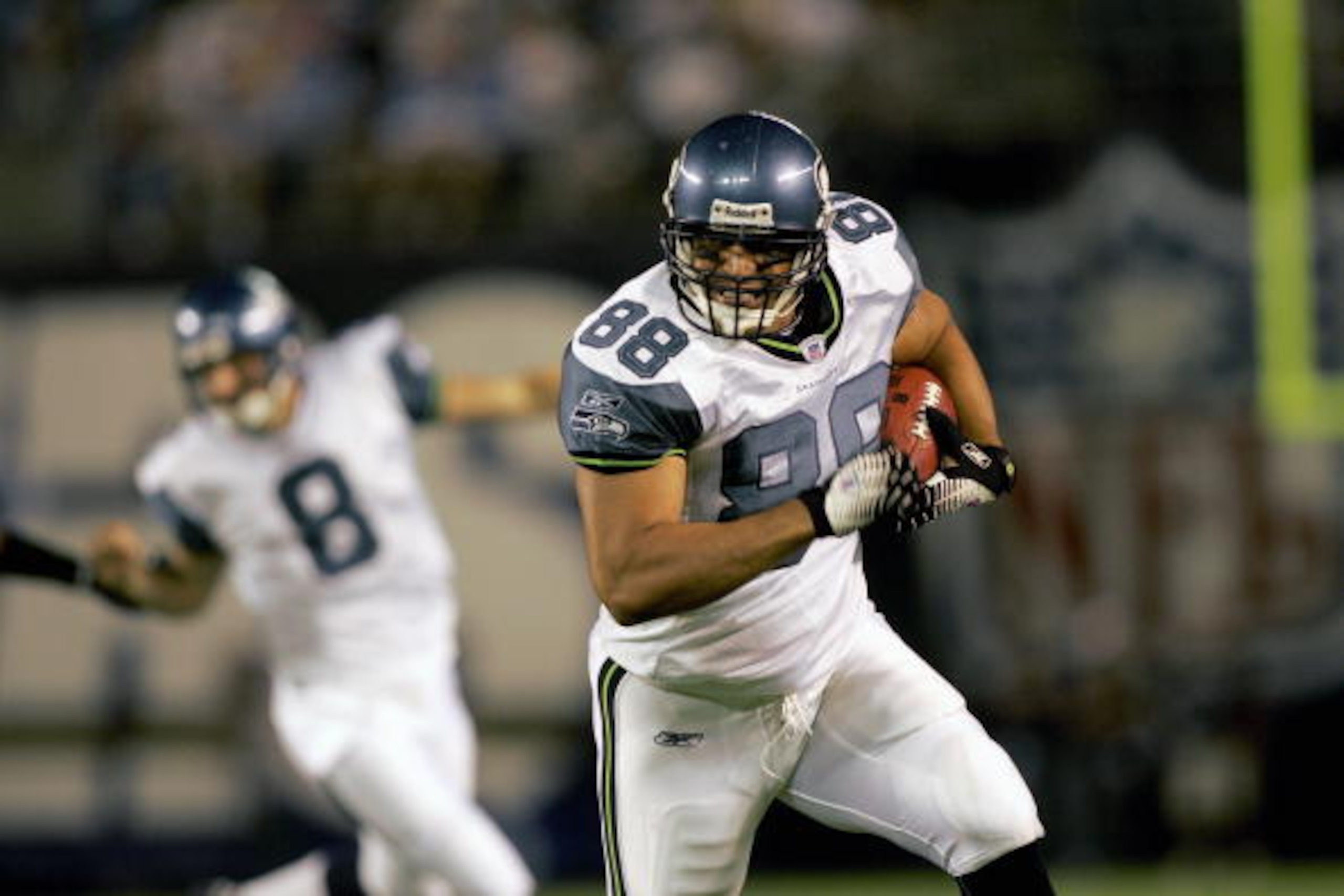 SAN DIEGO - AUGUST 26:  Tight end Itula Mili #88 of the Seattle Seahawks runs the ball against the San Diego Chargers on August 26, 2006 at Qualcomm Stadium in San Diego, California.  The Chargers won the game 31-20.  (Photo by Todd Warshaw/Getty Images)