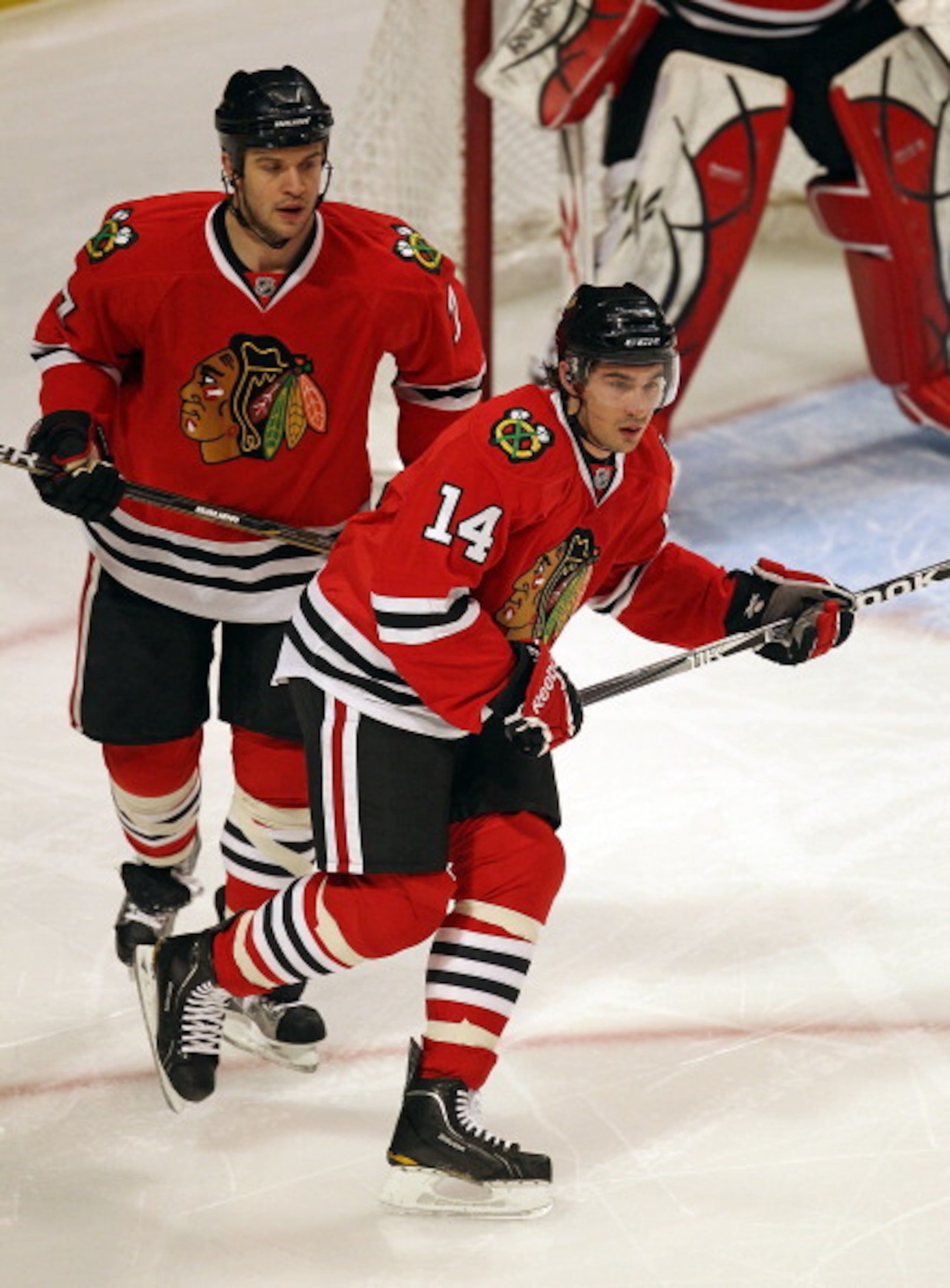 CHICAGO, IL - MARCH 02: Chris Campoli #14 and Brent Seabrook #7 of the Chicago Blackhawks skate to the puck against the Calgary Flames at the United Center on March 2, 2011 in Chicago, Illinois. The Blackhawks defeated the Flames 6-4. (Photo by Jonathan D CHICAGO, IL - MARCH 02: Chris Campoli #14 and Brent Seabrook #7 of the Chicago Blackhawks skate to the puck against the Calgary Flames at the United Center on March 2, 2011 in Chicago, Illinois. The Blackhawks defeated the Flames 6-4. (Photo by Jonathan D