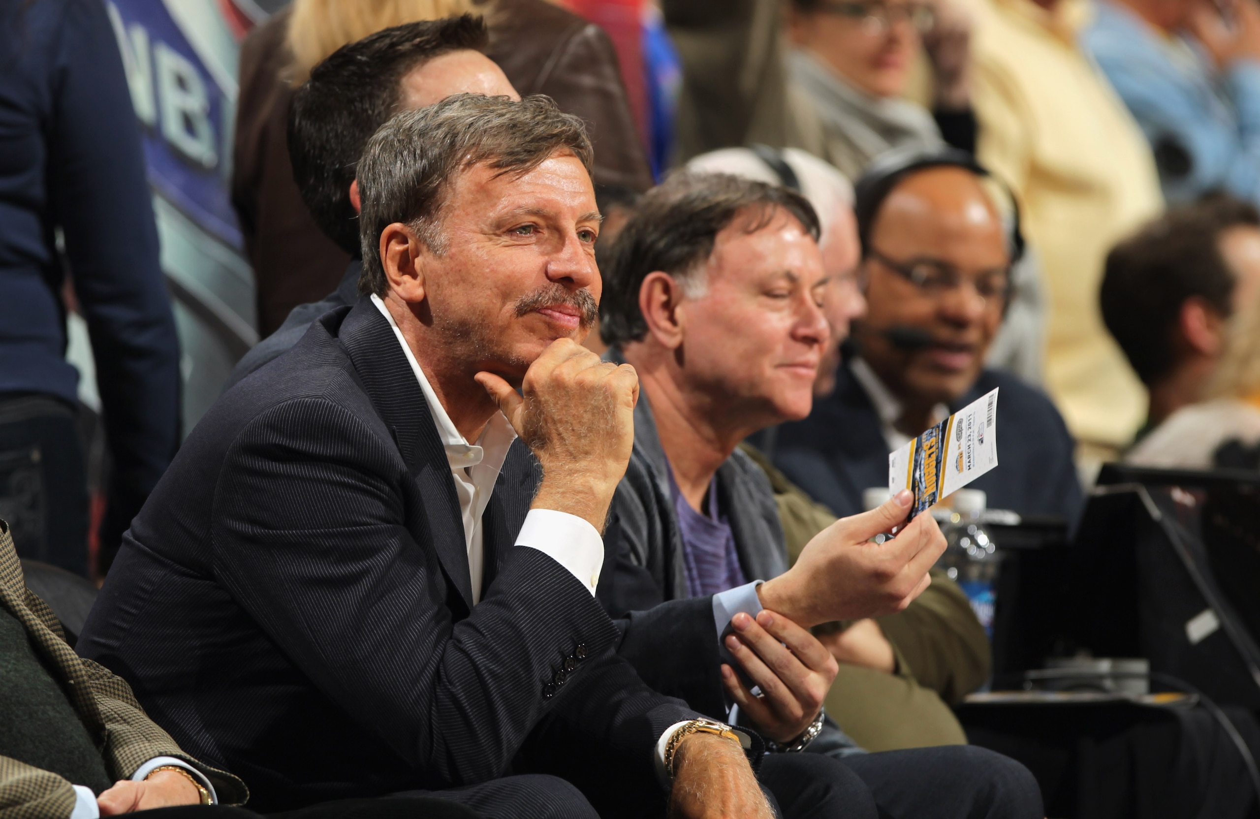 DENVER, CO - MARCH 23:  Stan Kroenke (L) watches from courtside seats as the Denver Nuggets host the San Antonio Spurs at the Pepsi Center on March 23, 2011 in Denver, Colorado. The Nuggets defeated the Spurs 115-112. NOTE TO USER: User expressly acknowle