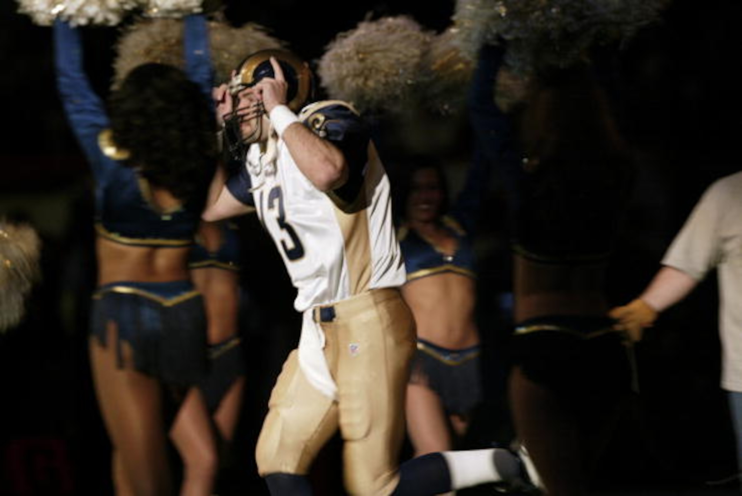 3 Feb 2002:   Rams quarterback Kurt Warner runs on the field in pregame introductions before Super Bowl XXXVI between the New England Patriots and the St. Louis Rams at the Superdome in New Orleans, Louisiana. DIGITAL IMAGE.  Mandatory Credit: Brian Bahr/