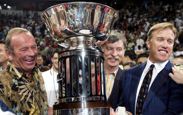 LAS VEGAS - JUNE 12:  (L-R) Owners Pat Bowlen, Stan Kroenke and John Elway of the Colorado Crush pose with the trophy after a 51-48 win over the Georgia Force in Arena Bowl XIX on June 12, 2005 at the Thomas and Mack Center in Las Vegas, Nevada.  (Photo b