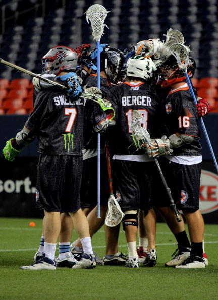 DENVER - JULY 16:  The Old School team celebrates after Brodie Merrill #17 of the Old School scored the game winning goal in overtime against the Young Guns during the 2009 Major League Lacrosse All Star Game at INVESCO Field at Mile High on July 16, 2009