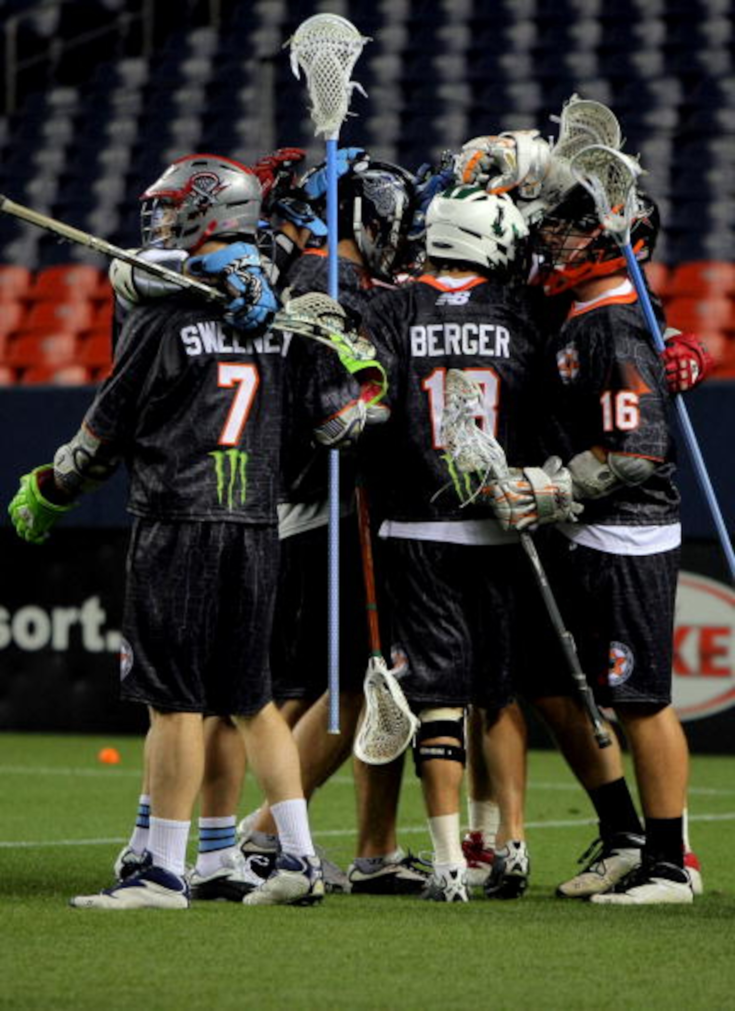 DENVER - JULY 16:  The Old School team celebrates after Brodie Merrill #17 of the Old School scored the game winning goal in overtime against the Young Guns during the 2009 Major League Lacrosse All Star Game at INVESCO Field at Mile High on July 16, 2009
