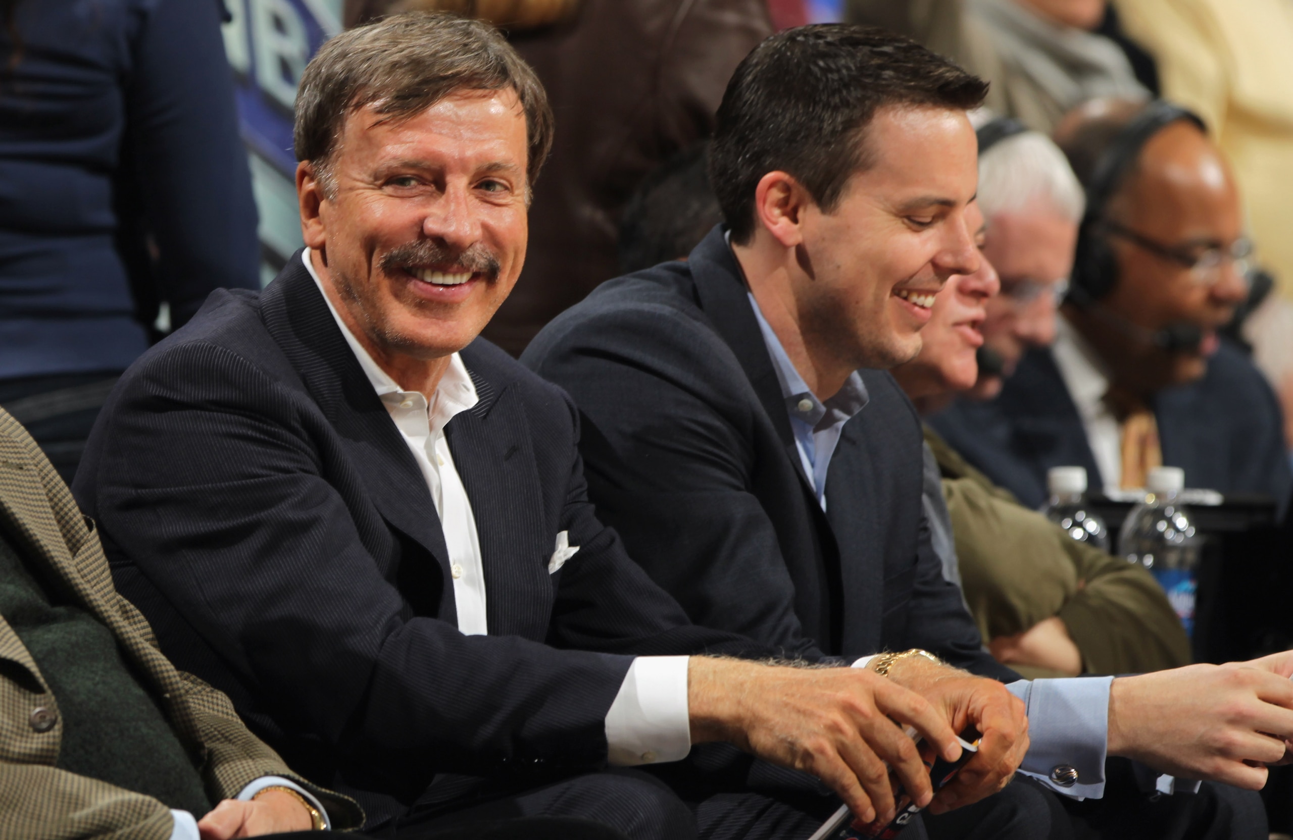 DENVER, CO - MARCH 23:  Stan Kroenke (L) along with his son Josh Kroenke (R) watch from courtside seats as the Denver Nuggets host the San Antonio Spurs at the Pepsi Center on March 23, 2011 in Denver, Colorado. The Nuggets defeated the Spurs 115-112. NOT