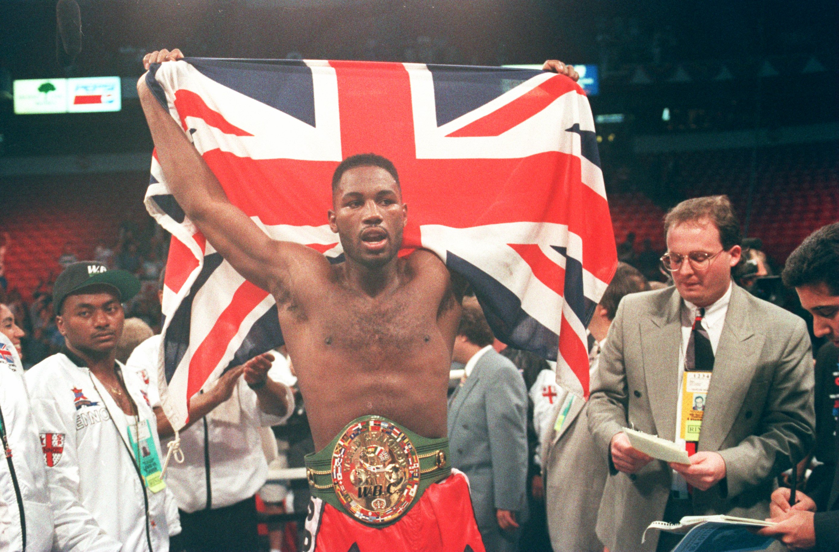 8 May 1993:  Lennox Lewis of Great Britain holds aloft the union jack after beating Tony Tucker of the USA in Las Vegas, Nevada in the USA