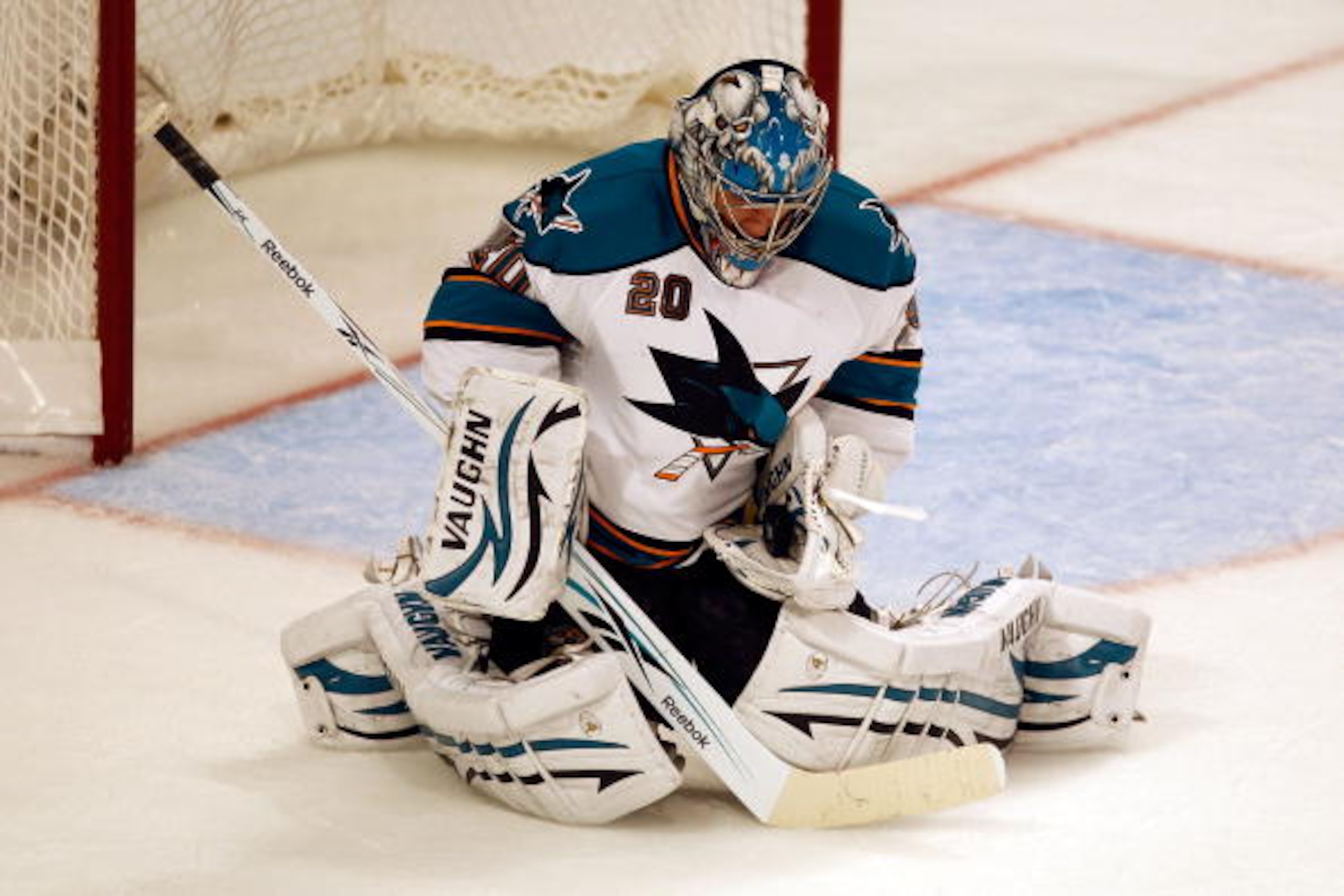 CHICAGO - MAY 23:  Goaltender Evgeni Nabokov #20 of the San Jose Sharks makes a second period save while taking on the Chicago Blackhawks in Game Four of the Western Conference Finals during the 2010 NHL Stanley Cup Playoffs at the United Center on May 23