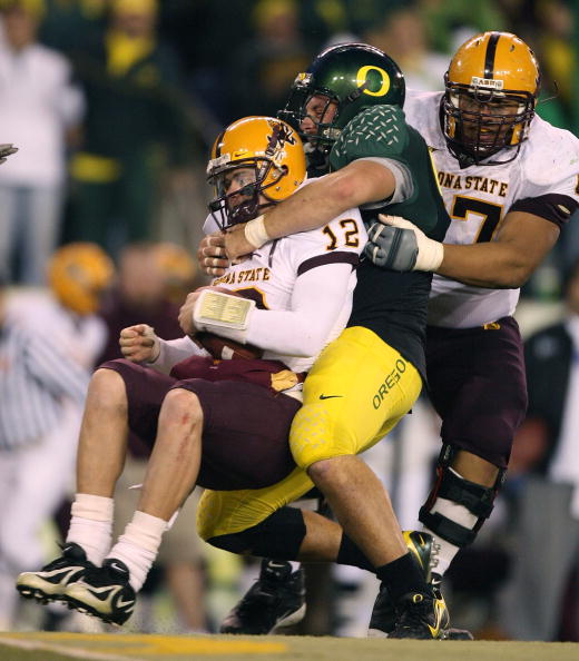 EUGENE, OR - NOVEMBER 03: Quarterback Rudy Carpenter #12 of the Arizona State Sun Devils is sacked by Nick Reed #49 of the Oregon Ducks at Autzen Stadium on November 3, 2007 in Eugene, Oregon. The Ducks defeated the Sun Devils 35-23. (Photo by Otto Greul EUGENE, OR - NOVEMBER 03: Quarterback Rudy Carpenter #12 of the Arizona State Sun Devils is sacked by Nick Reed #49 of the Oregon Ducks at Autzen Stadium on November 3, 2007 in Eugene, Oregon. The Ducks defeated the Sun Devils 35-23. (Photo by Otto Greul