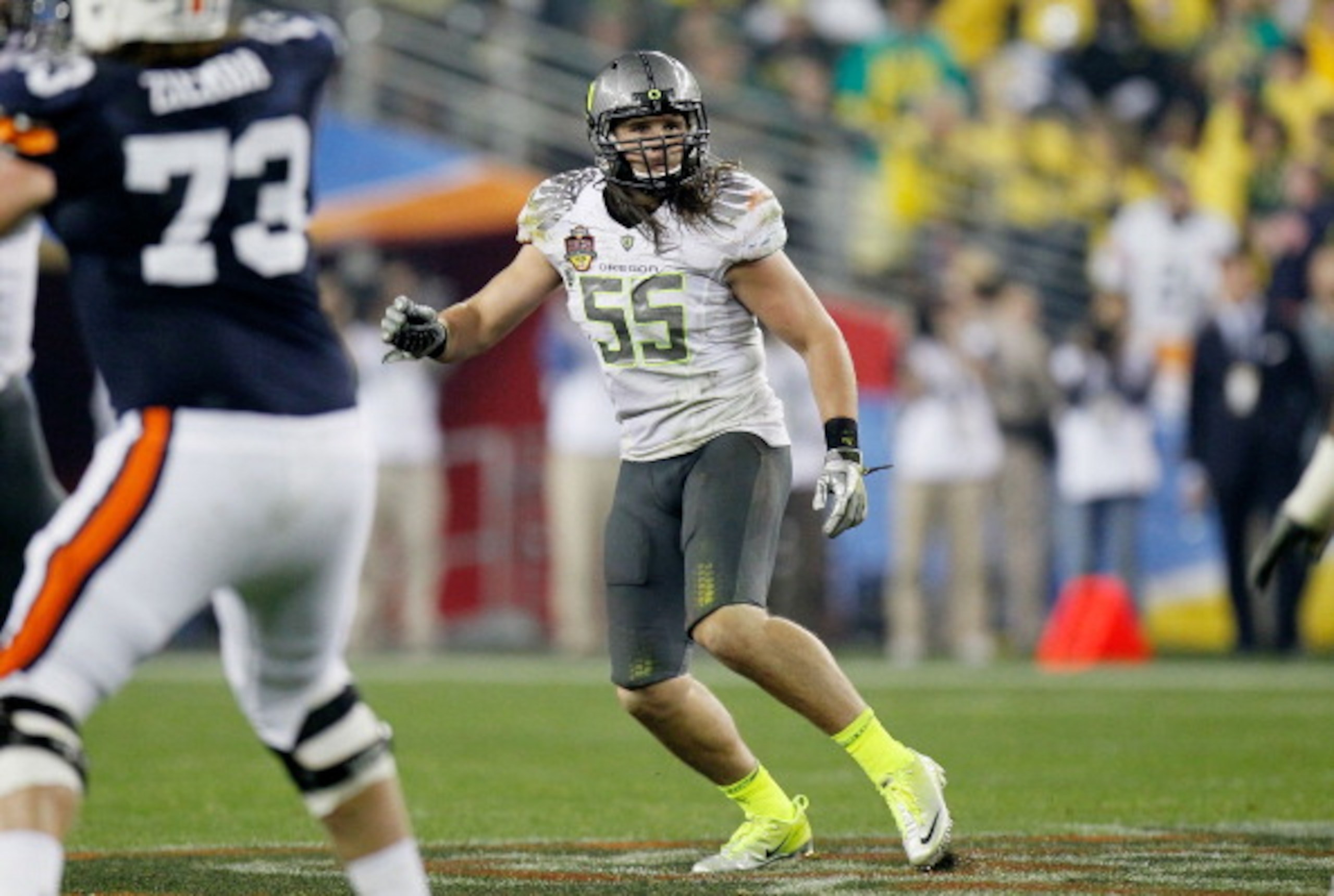 GLENDALE, AZ - JANUARY 10:  Casey Matthews #55 of the Oregon Ducks watches the play against the Auburn Tigers during the Tostitos BCS National Championship Game at University of Phoenix Stadium on January 10, 2011 in Glendale, Arizona.  (Photo by Kevin C.