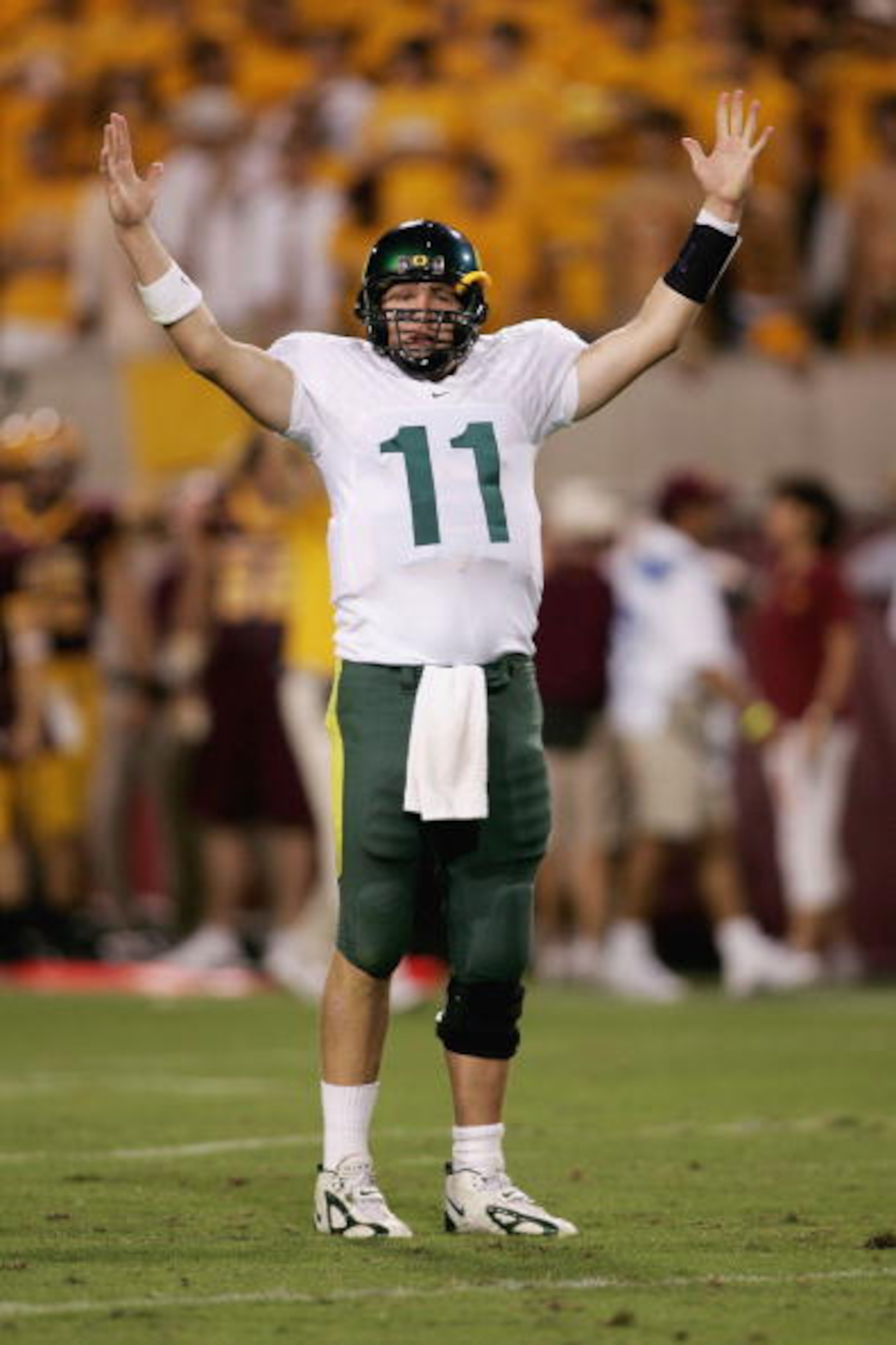 TEMPE, AZ - OCTOBER 08:   Kellen Clemens #11 of the Oregon Ducks celebrates a touchdown against the Arizona St. Sun Devils on October 8, 2005 at Sun Devil Stadium Stadium in Tempe, Arizona.   (Photo by Jonathan Ferrey/Getty Images)