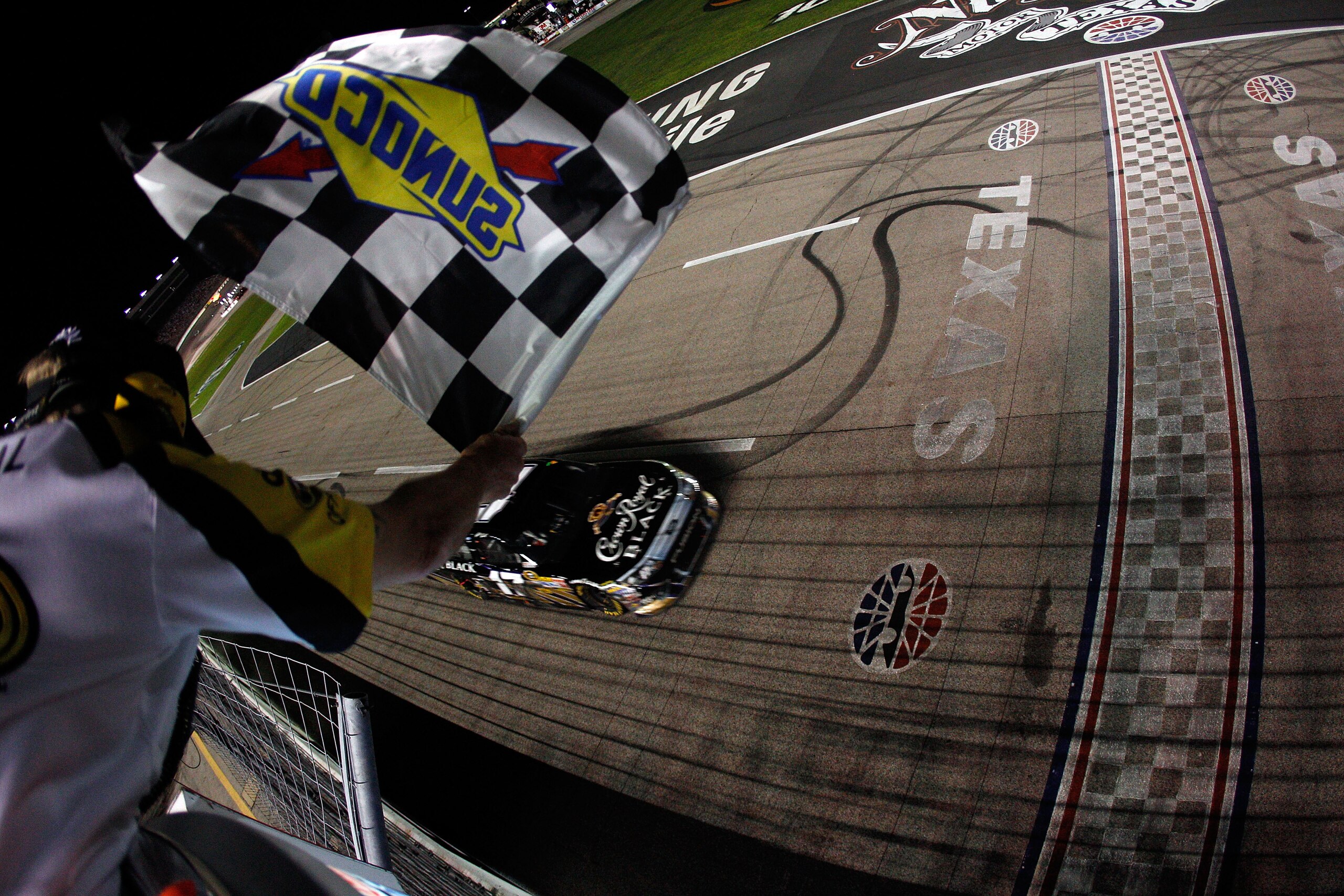 FORT WORTH, TX - APRIL 09:  Matt Kenseth, driver of the #17 Crown Royal Black Ford, crosses the finish line to win the NASCAR Sprint Cup Series Samsung Mobile 500 at Texas Motor Speedway on April 9, 2011 in Fort Worth, Texas.  (Photo by Chris Graythen/Get