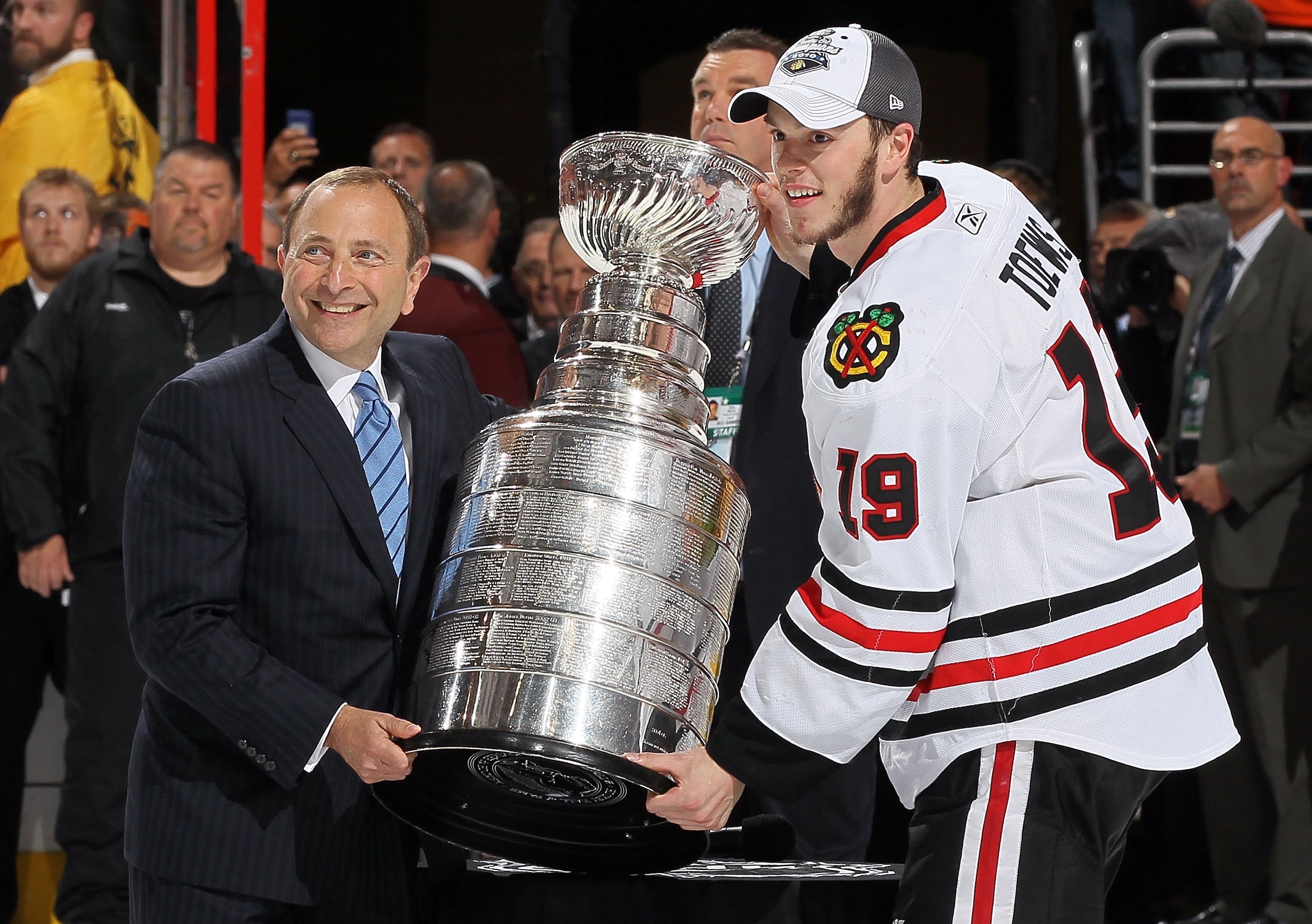 PHILADELPHIA - JUNE 09: NHL Commissioner Gary Bettman presents Jonathan Toews #19 of the Chicago Blackhawks with the Stanley Cup after teammate Patrick Kane scored the game-winning goal in overtime to defeat the Philadelphia Flyers 4-3 and win the Stanley PHILADELPHIA - JUNE 09: NHL Commissioner Gary Bettman presents Jonathan Toews #19 of the Chicago Blackhawks with the Stanley Cup after teammate Patrick Kane scored the game-winning goal in overtime to defeat the Philadelphia Flyers 4-3 and win the Stanley