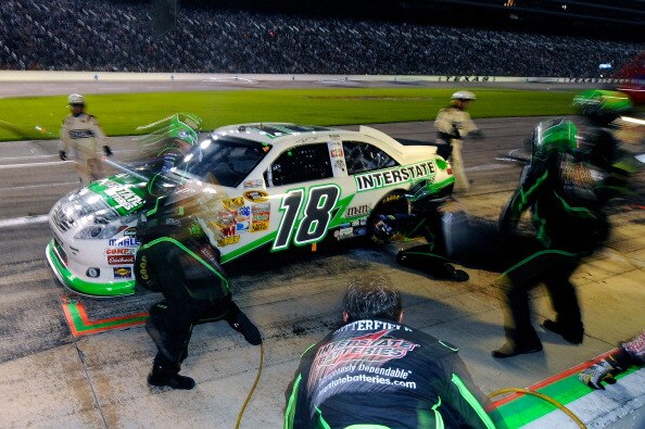 FORT WORTH, TX - APRIL 09:  Kyle Busch, driver of the #18 Interstate Batteries Toyota, makes a pit stop during the NASCAR Sprint Cup Series Samsung Mobile 500 at Texas Motor Speedway on April 9, 2011 in Fort Worth, Texas.  (Photo by Jared C. Tilton/Getty 