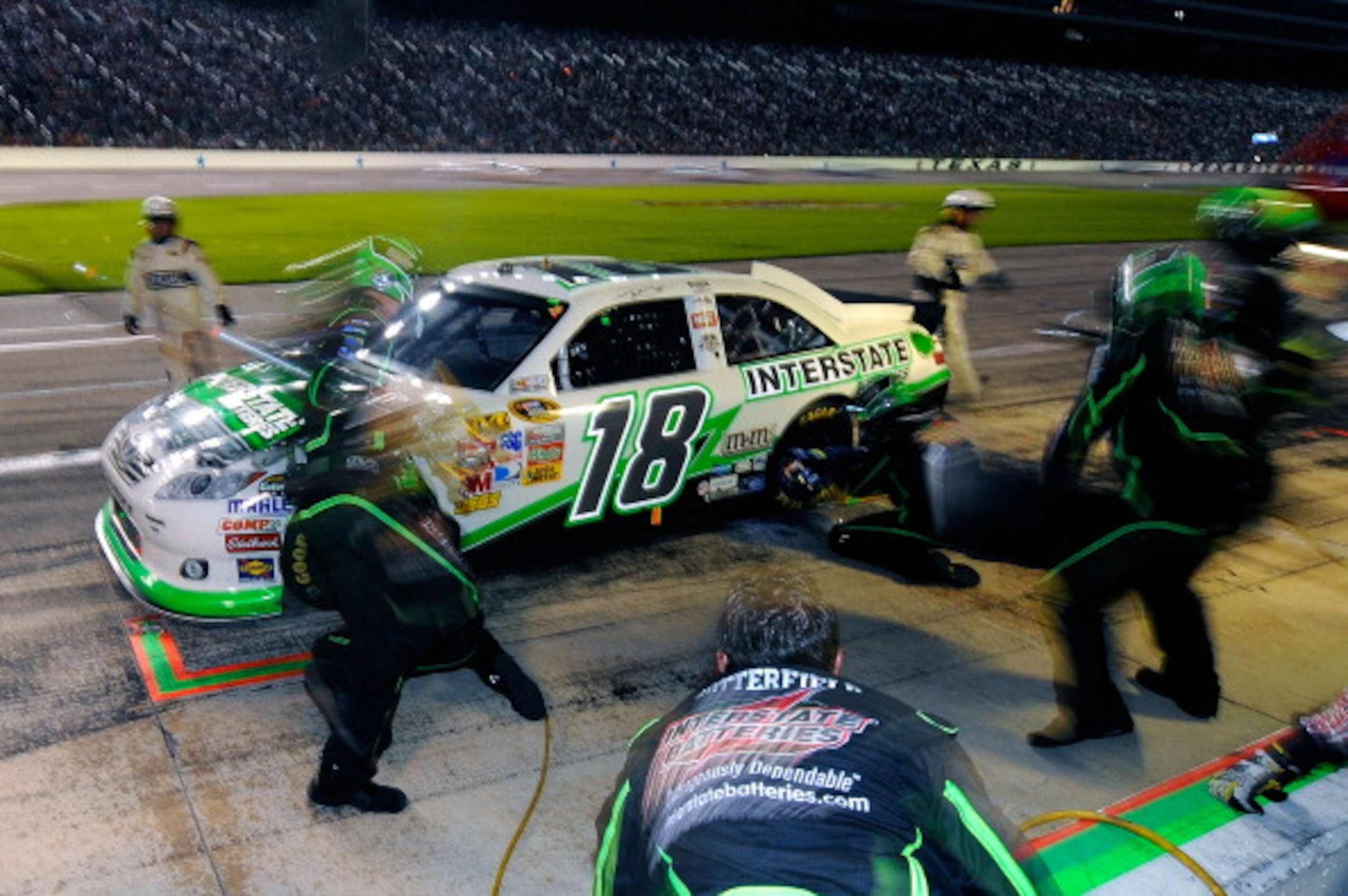 FORT WORTH, TX - APRIL 09:  Kyle Busch, driver of the #18 Interstate Batteries Toyota, makes a pit stop during the NASCAR Sprint Cup Series Samsung Mobile 500 at Texas Motor Speedway on April 9, 2011 in Fort Worth, Texas.  (Photo by Jared C. Tilton/Getty 