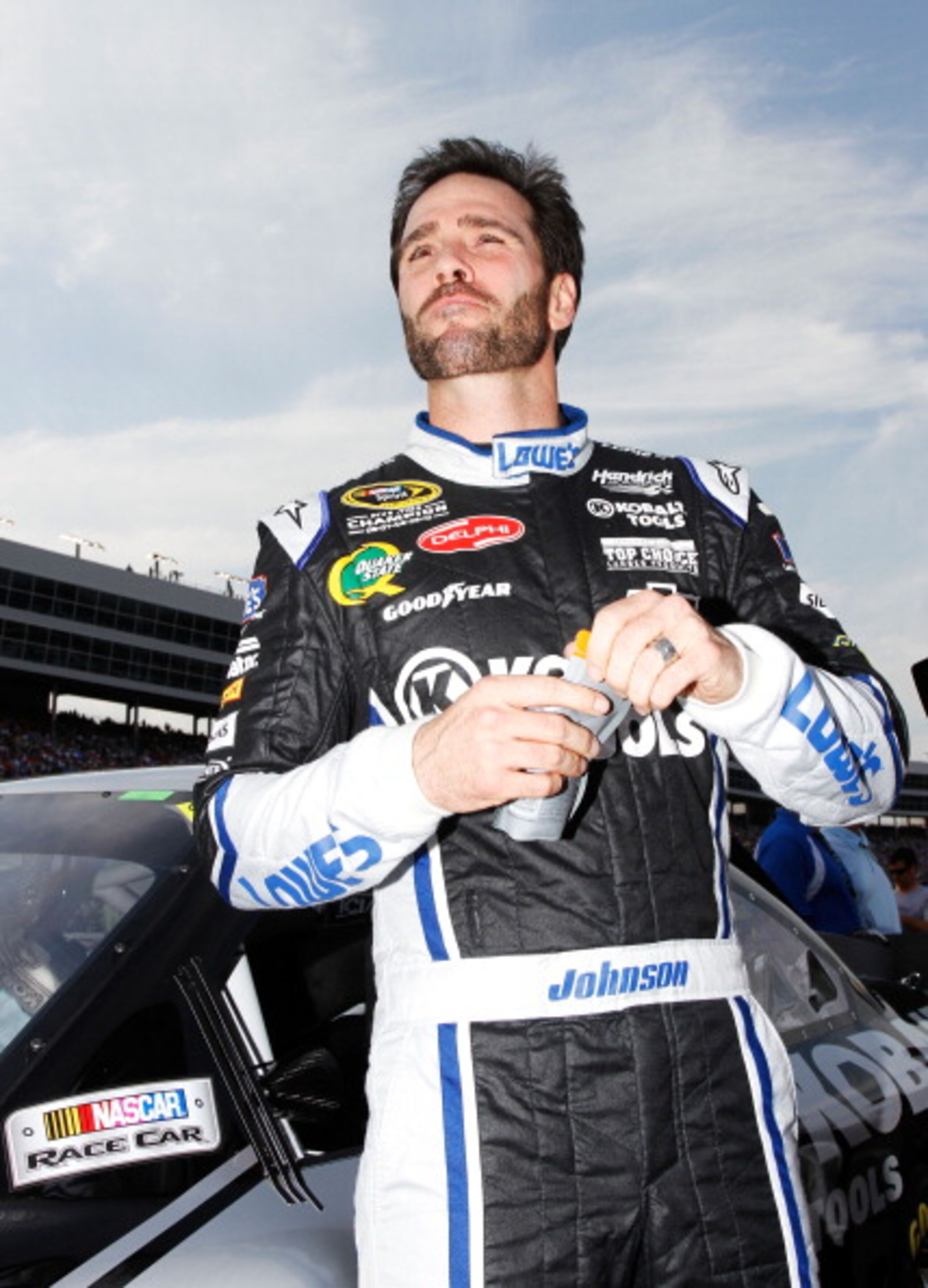 FORT WORTH, TX - APRIL 09:  Jimmie Johnson, driver of the #48 Lowe's/Kobalt Tools Chevrolet, stands on the grid prior to the start of the NASCAR Sprint Cup Series Samsung Mobile 500 at Texas Motor Speedway on April 9, 2011 in Fort Worth, Texas.  (Photo by