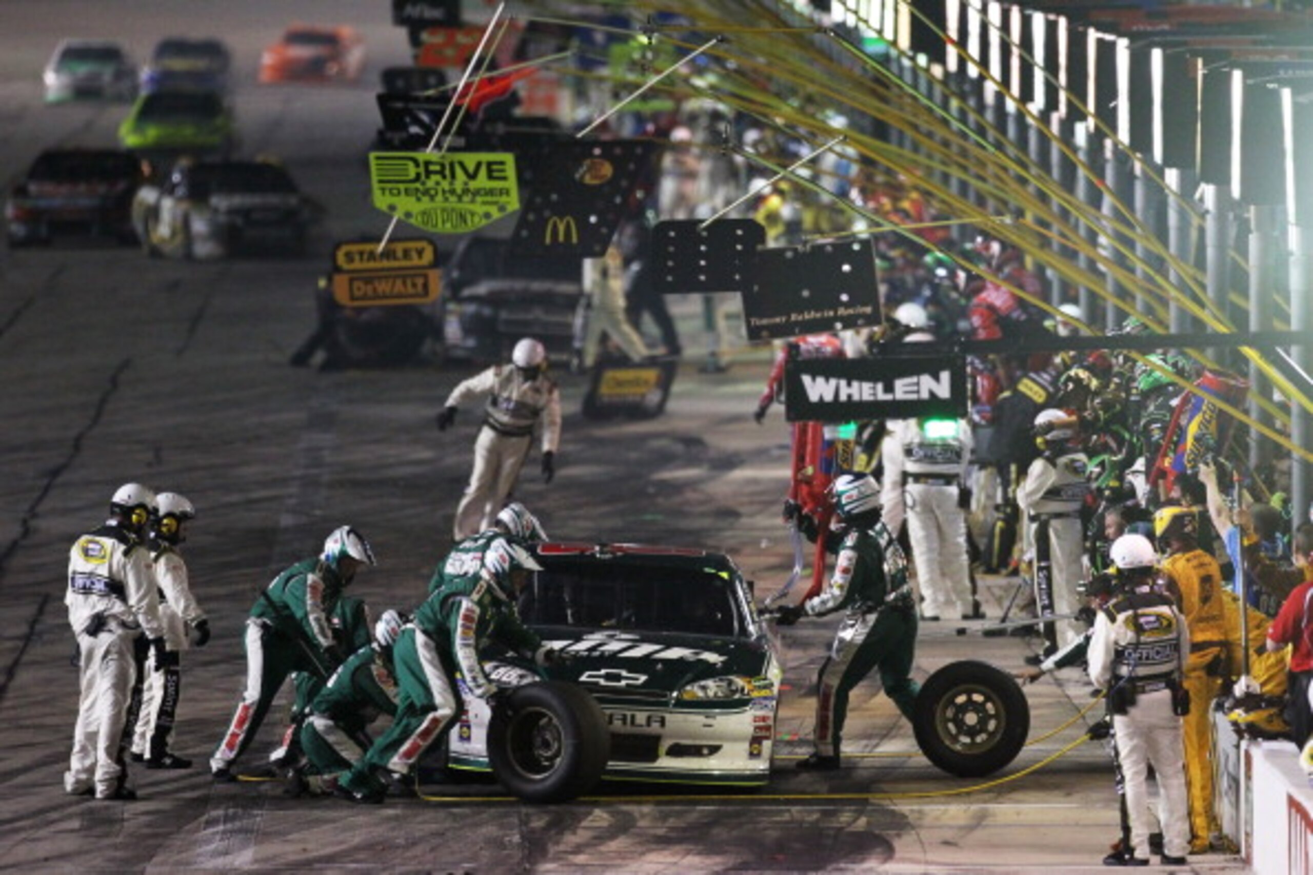 FORT WORTH, TX - APRIL 09:  Dale Earnhardt Jr. pits the #88 Amp Energy/National Guard Chevrolet during the NASCAR Sprint Cup Series Samsung Mobile 500 at Texas Motor Speedway on April 9, 2011 in Fort Worth, Texas.  (Photo by Jonathan Ferrey/Getty Images f