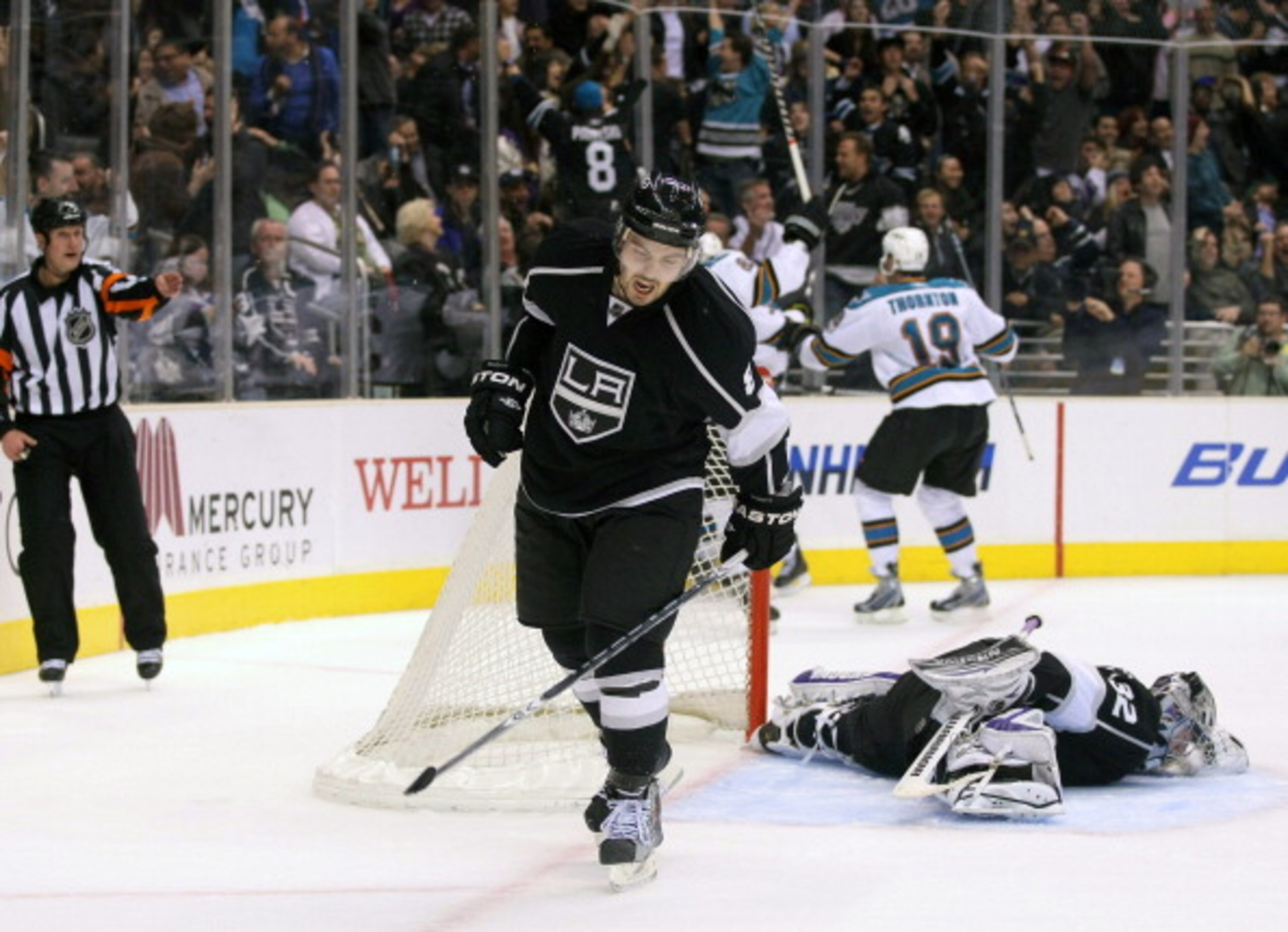 LOS ANGELES, CA - MARCH 24:  Drew Doughty #8 of the Los Angeles Kings reacts after Patrick Marleau #12 of the San Jose Sharks scored with less than five seconds left to tie the game 3-3 in the third period to force overtime during the NHL game at Staples