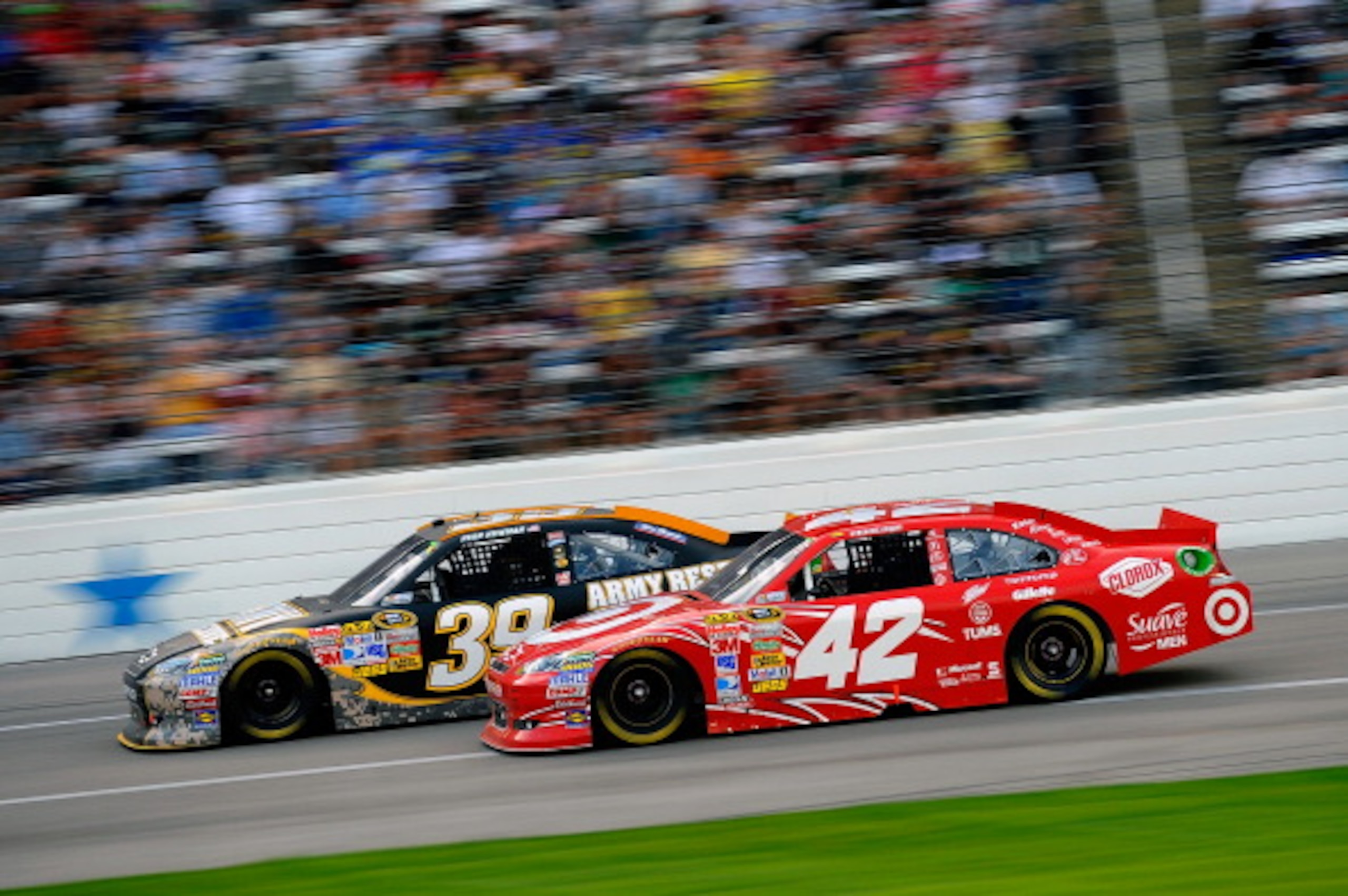 FORT WORTH, TX - APRIL 09:  Ryan Newman, driver of the #39 U.S. Army Reserve Chevrolet, races Juan Pablo Montoya, driver of the #42 Target Chevrolet, during the NASCAR Sprint Cup Series Samsung Mobile 500 at Texas Motor Speedway on April 9, 2011 in Fort W